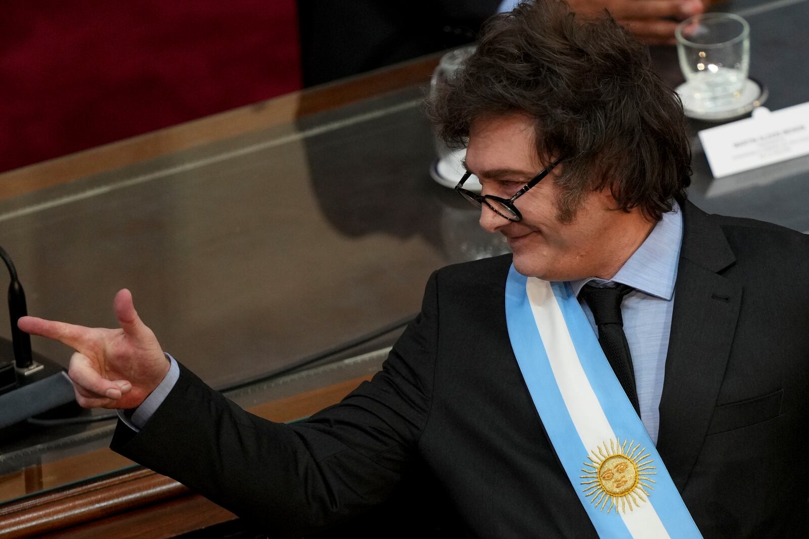 Argentina's President Javier Milei smiles as he delivers the annual State of the Nation address, which marks the start of the legislative year, in Buenos Aires, Argentina, Saturday, March 1, 2025. (AP Photo/Rodrigo Abd)