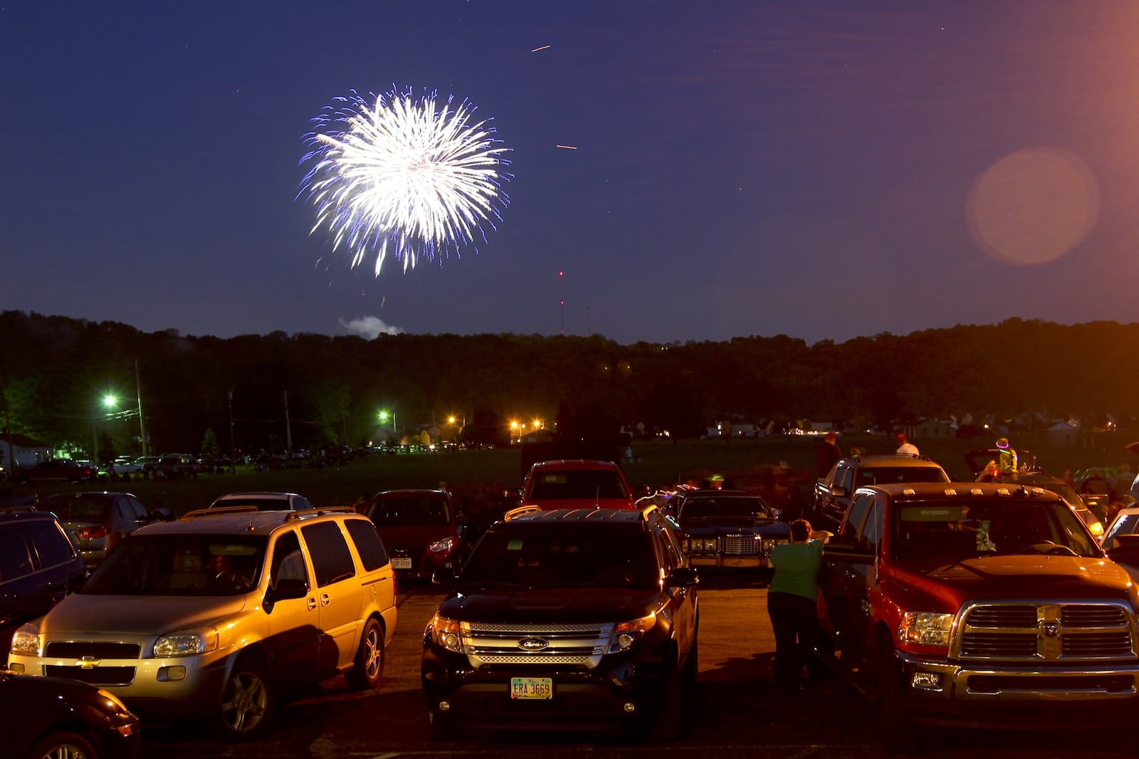 Spectators watch from Fairfield West Baptist Church as Rozzi’s Famous Fireworks fill the sky in Fairfield during the Red White and Kaboom celebration, Friday, July 3, 2014. GREG LYNCH / STAFF