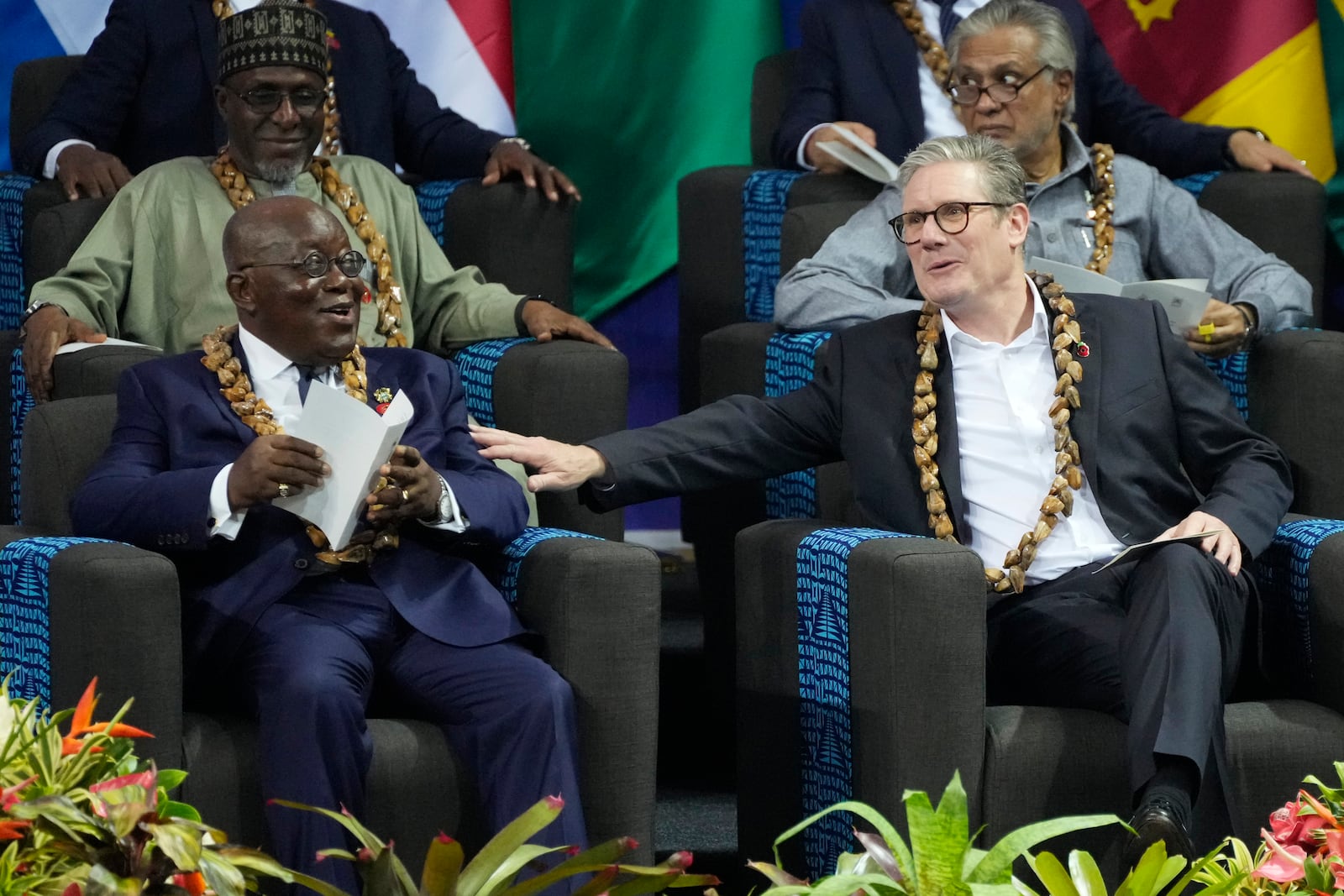 The president of Ghana, Nana Akufo-Addo, left, and British Prime Minister Keir Starmer talk during the Opening Ceremony of the Commonwealth Heads of Government Meeting 2024 at the Commonwealth Heads of Government meeting in Apia, Samoa, Friday, Oct. 25, 2024. (AP Photo/Rick Rycroft, Pool)