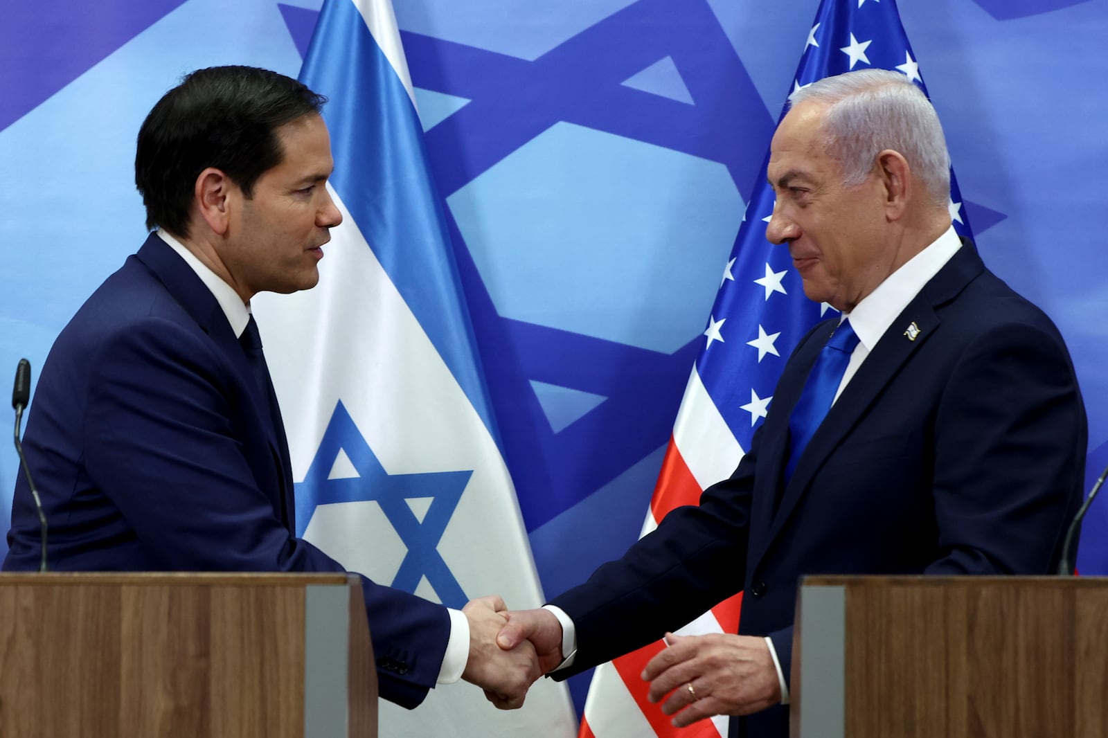 U.S. Secretary of State Marco Rubio, left, and Israeli Prime Minister Benjamin Netanyahu shake hands as they make joint statements to the press at the Prime Minister's office in Jerusalem, Israel, Sunday, Feb. 16, 2025. (Evelyn Hockstein/Pool Photo via AP)