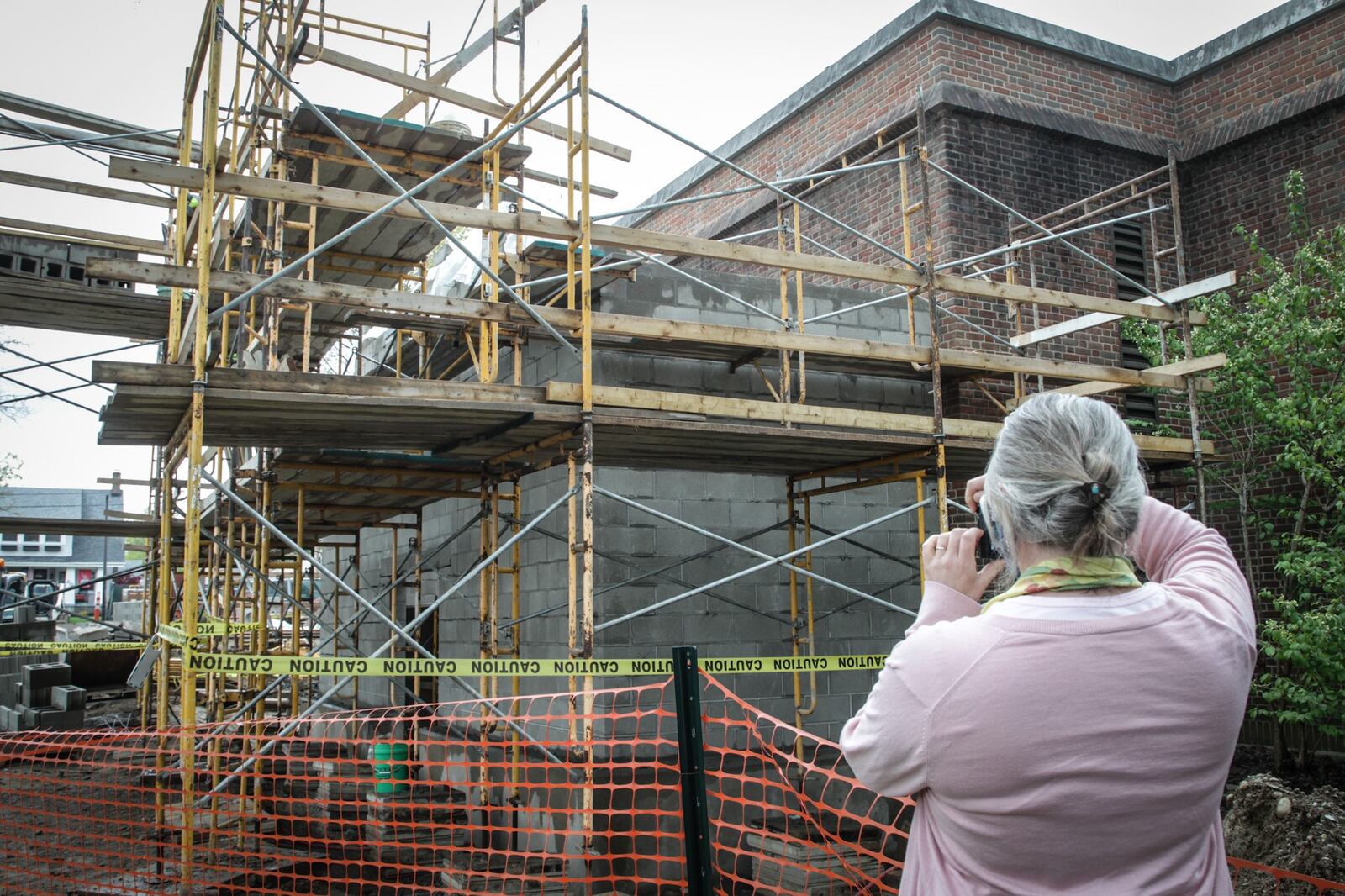 Wright Memorial Public Library has reached more than 90% of its $1.5 million capital campaign goal to renovate the historic site. Construction crews are now work on a entrance in the back of the building. JIM NOELKER/STAFF