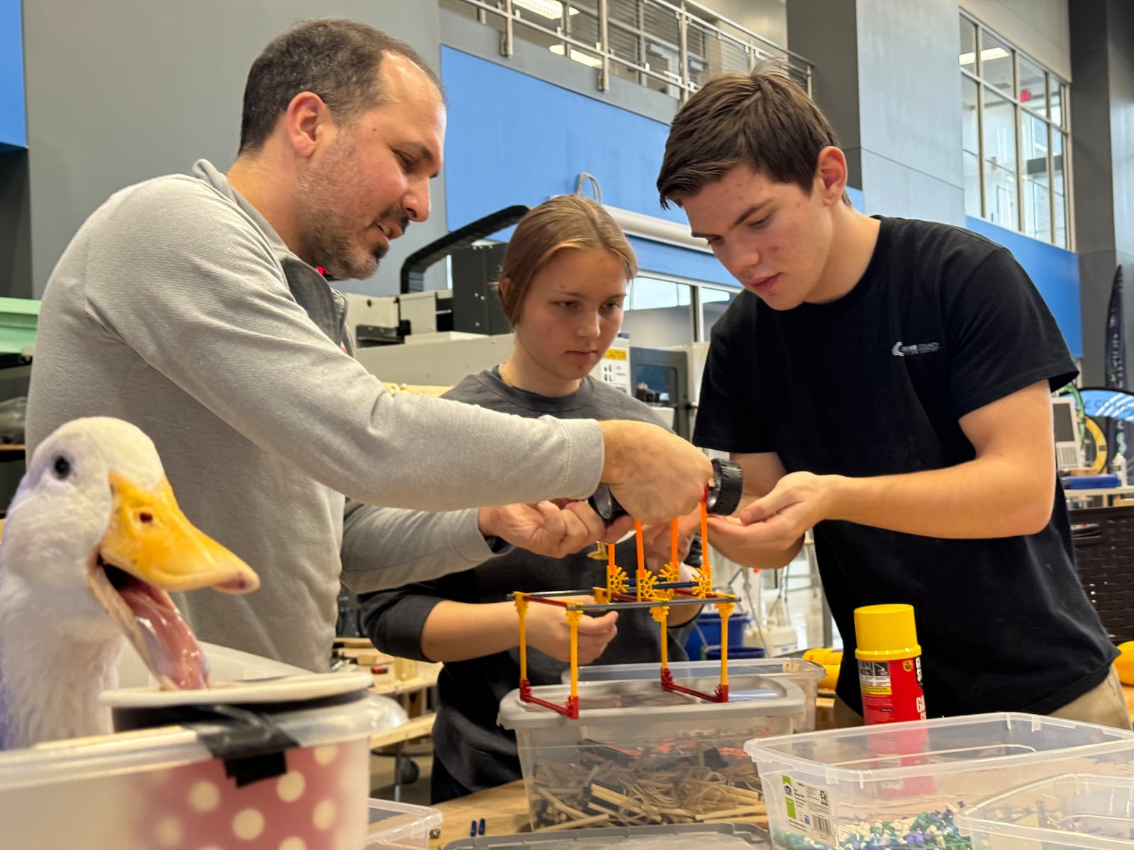 Advanced Engineering Systems juniors, Corinne Gill and Liam Walsh, work with Mr. Picard on developing a prosthetic for Geico the duck’s malformed leg.