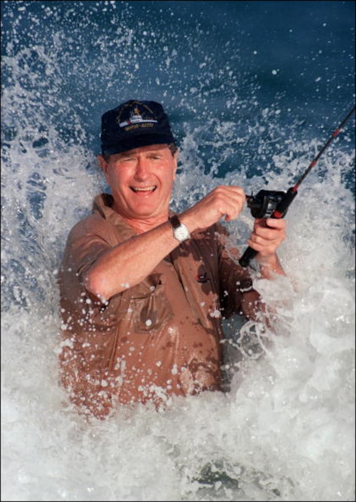 1988: George Bush is smashed by a wave while fishing in back of the home of William Farish in Florida