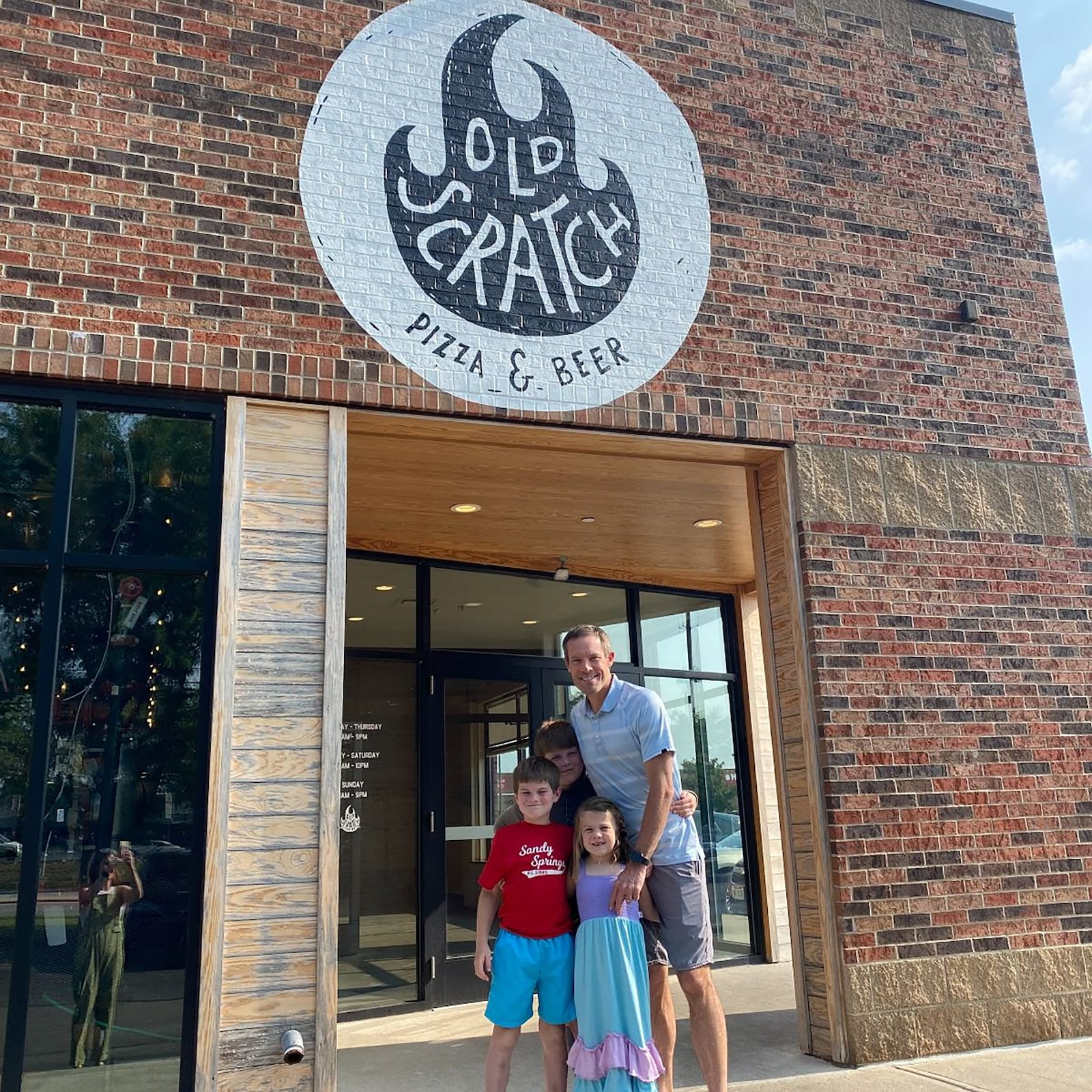 Long with his children at Old Scratch Pizza in Centerville. L-R Bennet, Caleb, Virginia and Long.