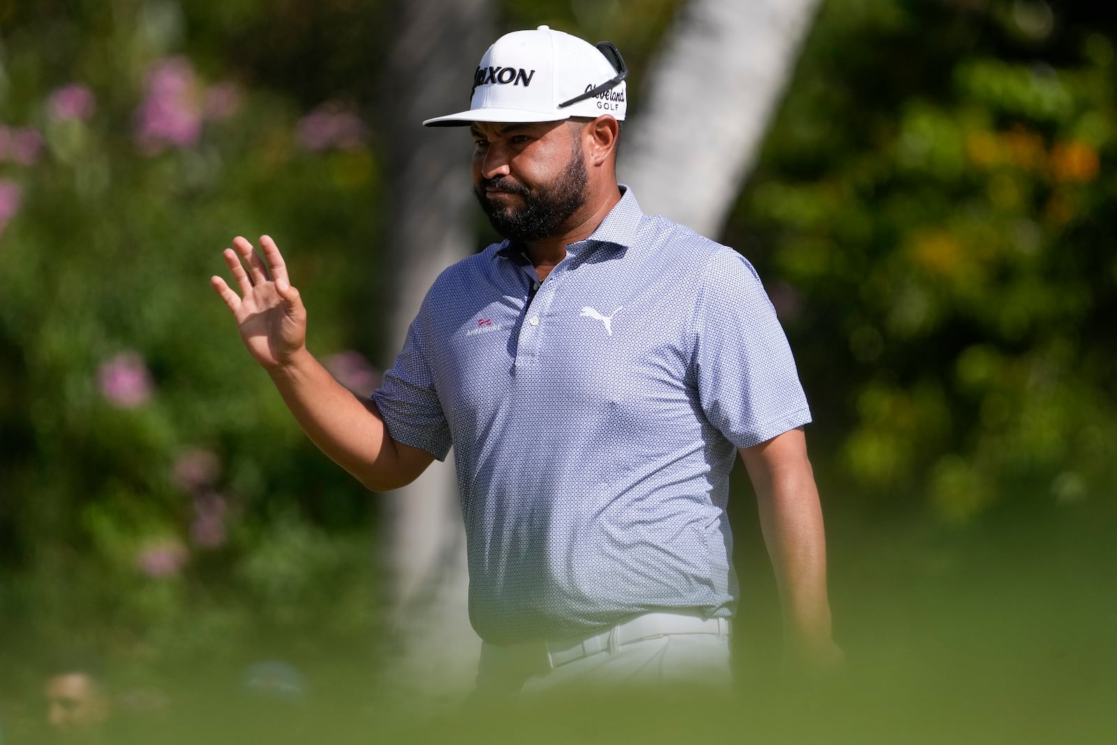 J.J. Spaun reacts after a shot during the final round of the Sony Open golf event, Sunday, Jan. 12, 2025, at Waialae Country Club in Honolulu. (AP Photo/Matt York)