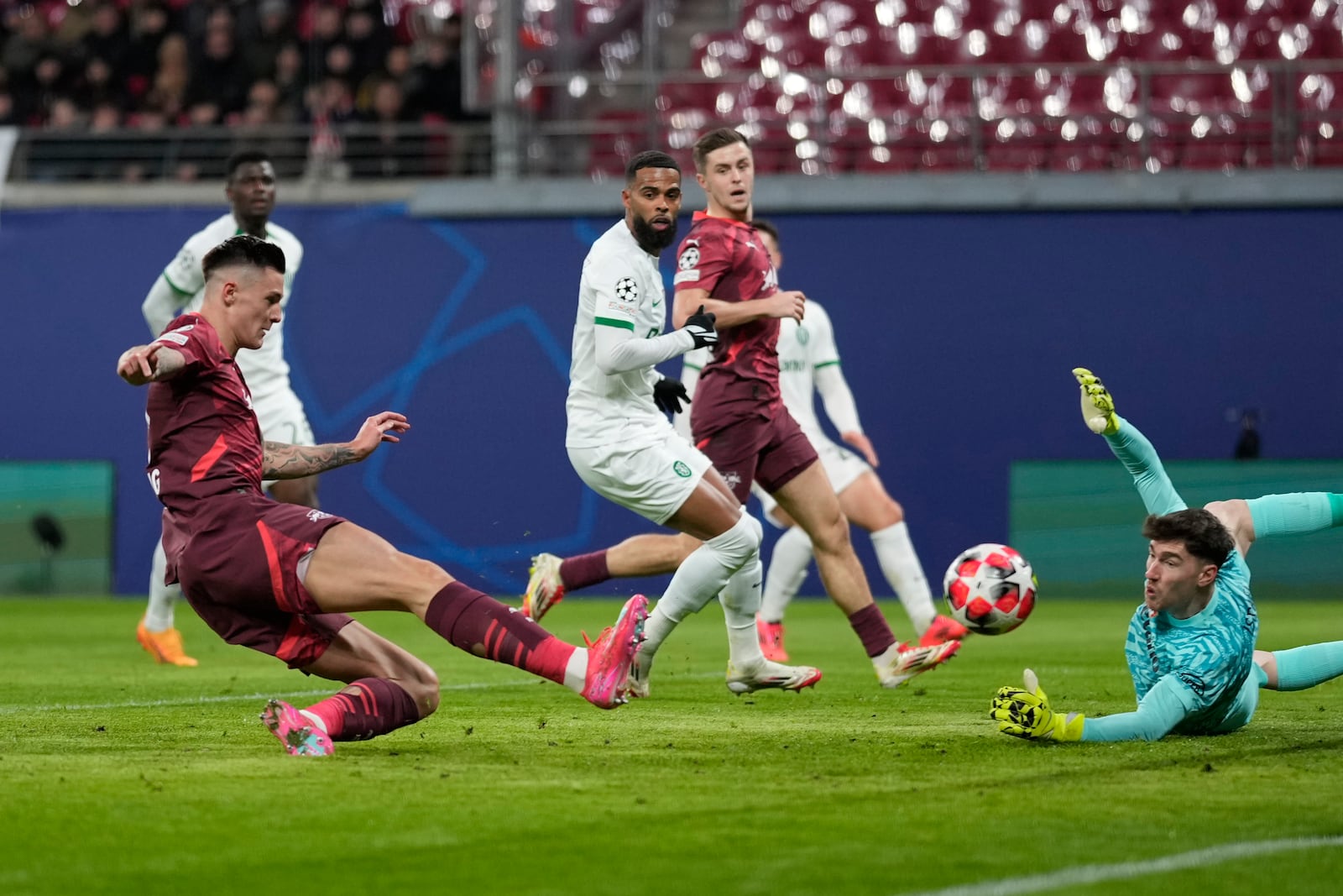 Leipzig's Benjamin Sesko scores his side's opening goal during the Champions League soccer match between RB Leipzig and Sporting CP at the RB Arena in Leipzig, Germany, Wednesday, Jan. 22, 2025. (AP Photo/Matthias Schrader)