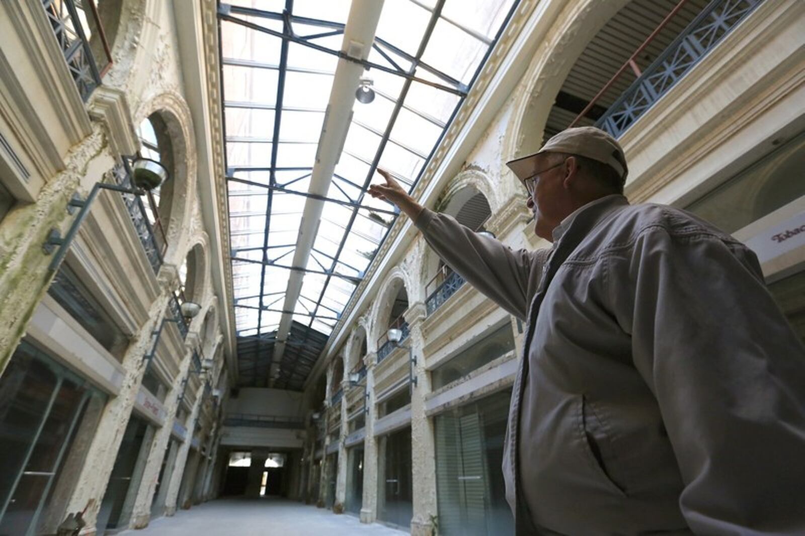 John Gower leads a tour through the Third Street arcade section of the Dayton Arcade. STAFF