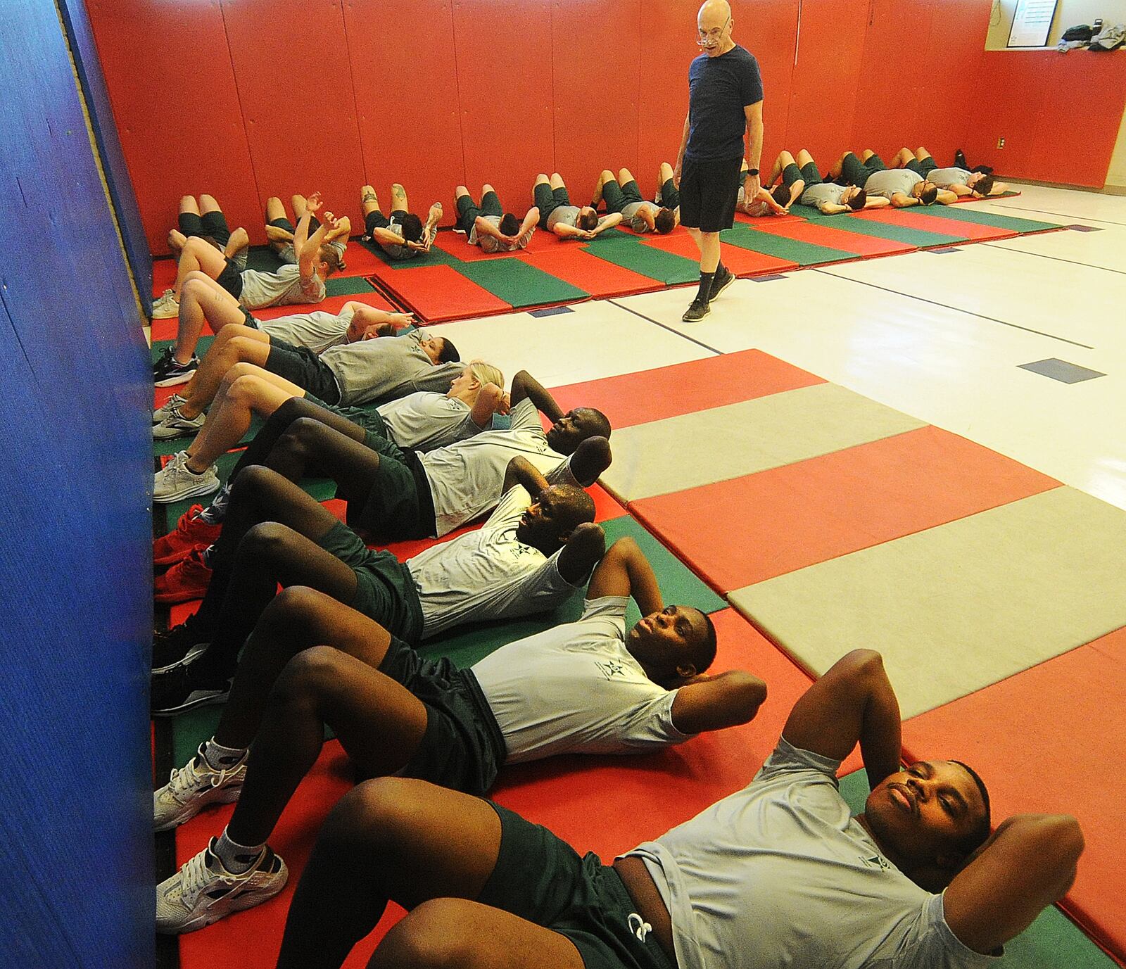 Police cadets at Sinclair Community College perform sit-ups as part of morning physical training, Thursday, Jan. 11, 2024. MARSHALL GORBY\STAFF