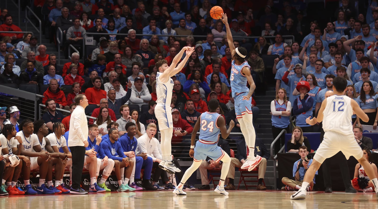 Dayton's DaRon Holmes II defends a 3-pointer by Gibson Jimerson, of Saint Louis, on Tuesday, Jan. 16, 2024, at UD Arena. David Jablonski/Staff