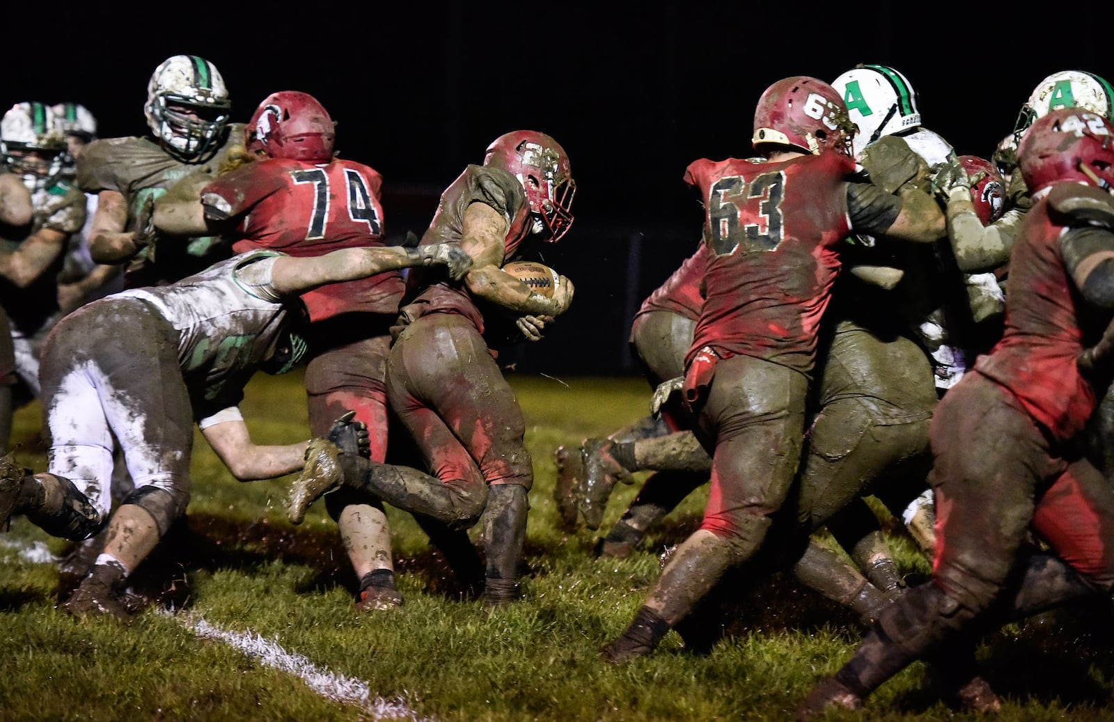 Madison’s Cameron Svarda scores the game-winning touchdown during Friday night’s Division V, Region 20 playoff game against Anna at Brandenburg Field in Madison Township. NICK GRAHAM/STAFF