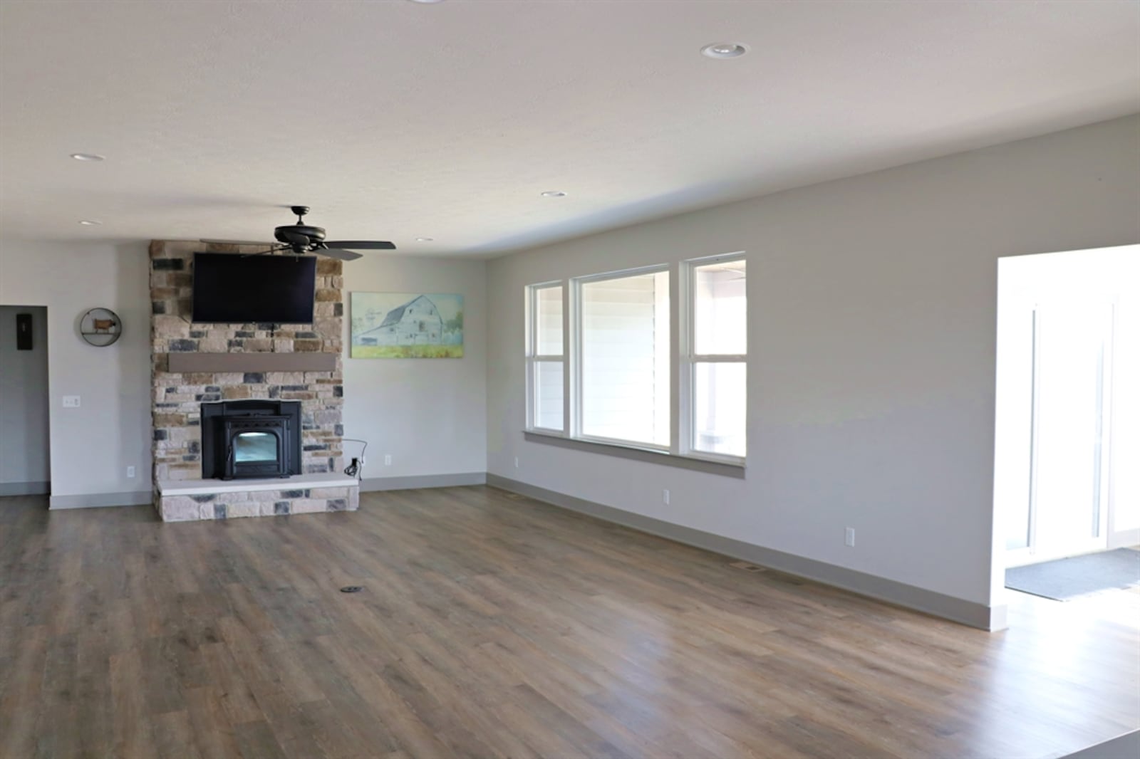 The fireplace is the centerpiece of the great room and features media outlets.