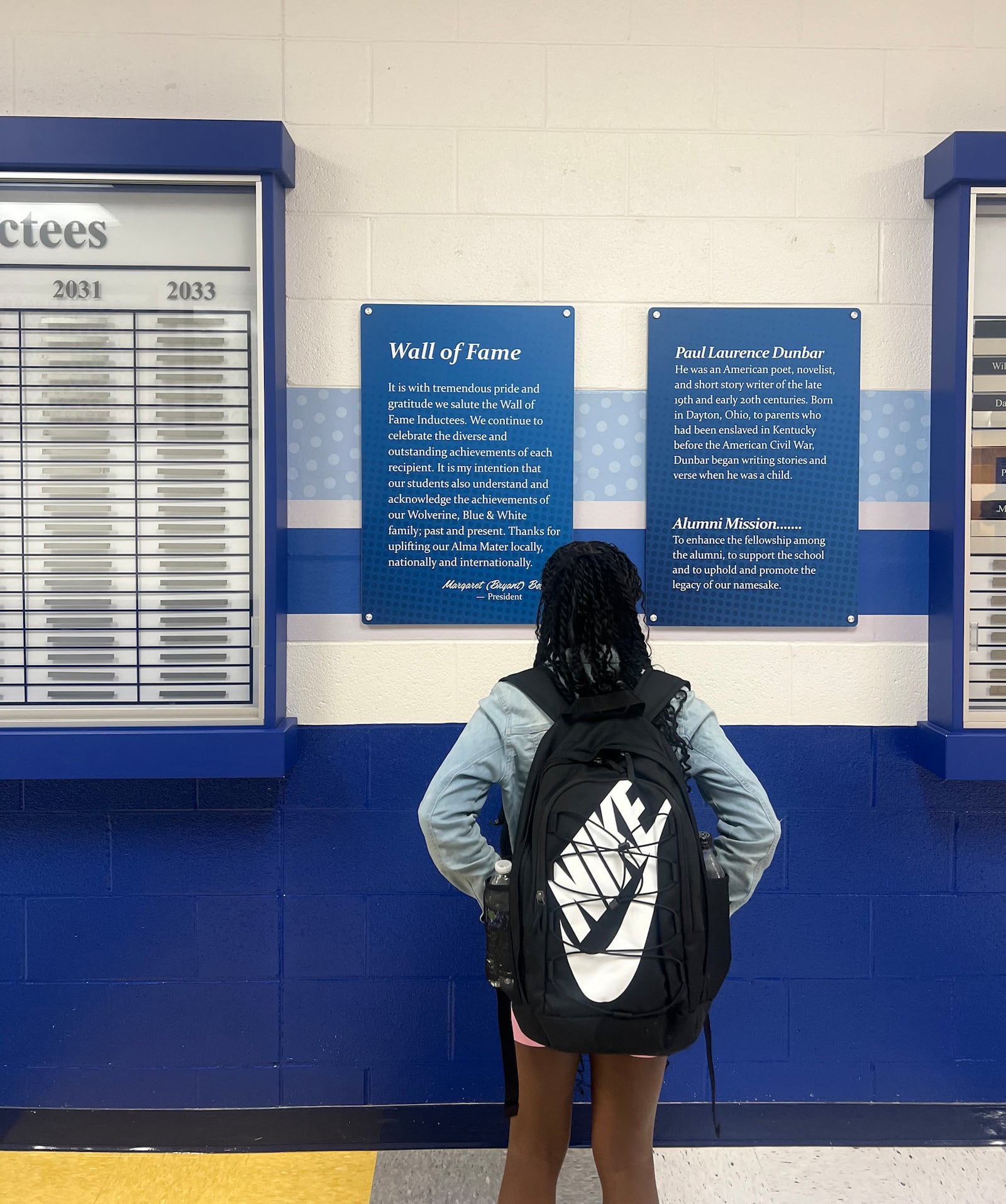 Student Dai’Vontay Young studies the information on the Wall of Fame. Contributed