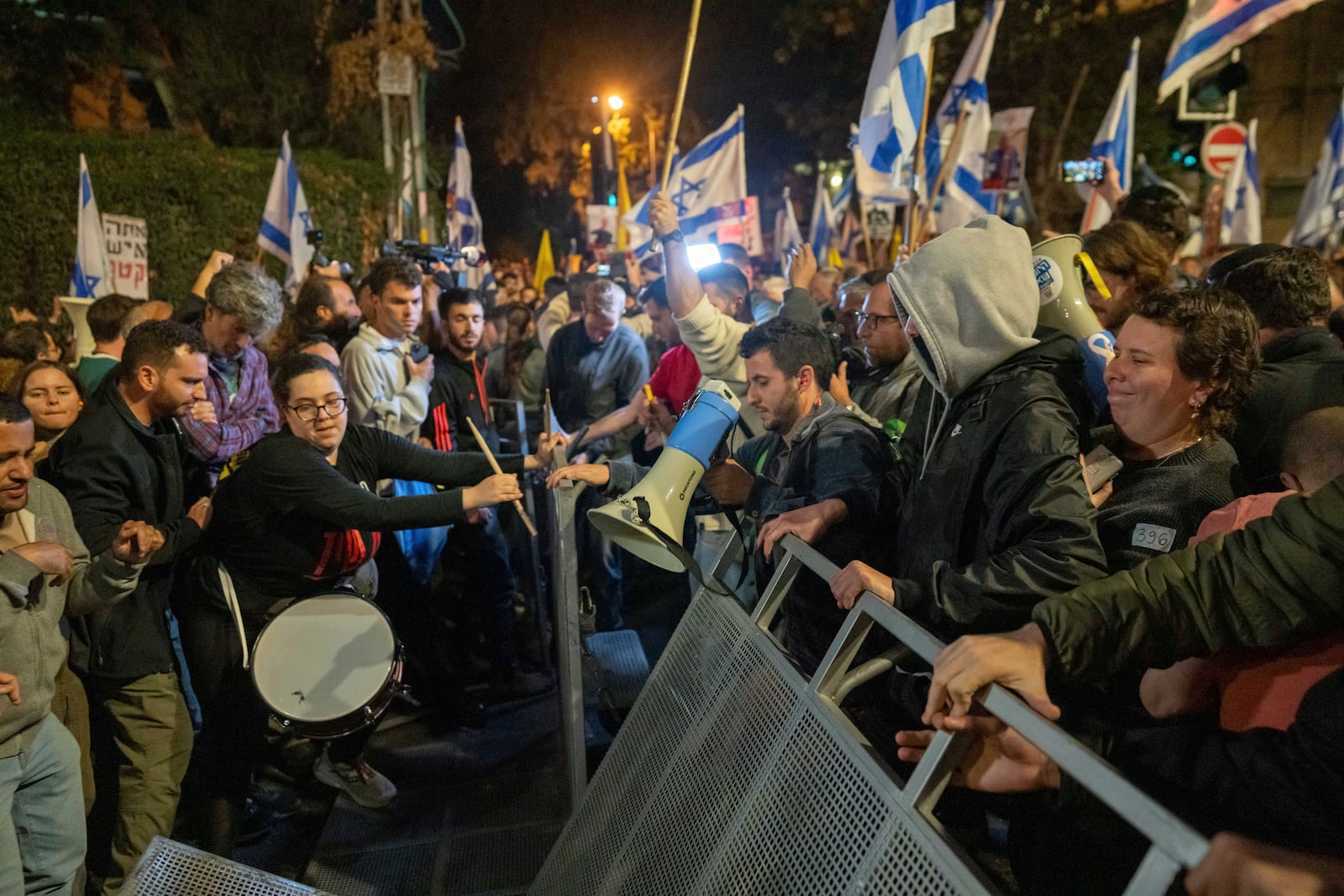 People protest against Prime Minister Benjamin Netanyahu near his residence in Jerusalem after he has dismissed his defense minister Yoav Gallant in a surprise announcement Tuesday, Nov. 5, 2024. (AP Photo/Ohad Zwigenberg)