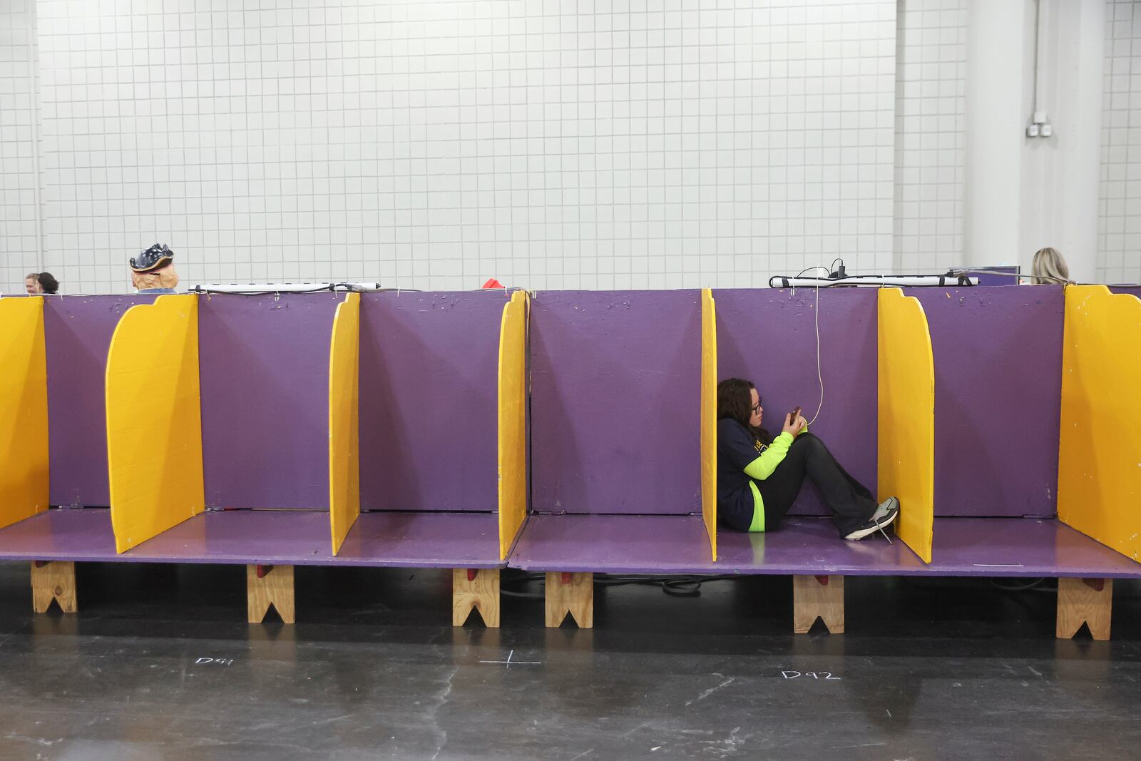 People utilize the empty demo ring benching area for dogs at the 149th Westminster Kennel Club Dog show, Saturday, Feb. 8, 2025, in New York. (AP Photo/Heather Khalifa)