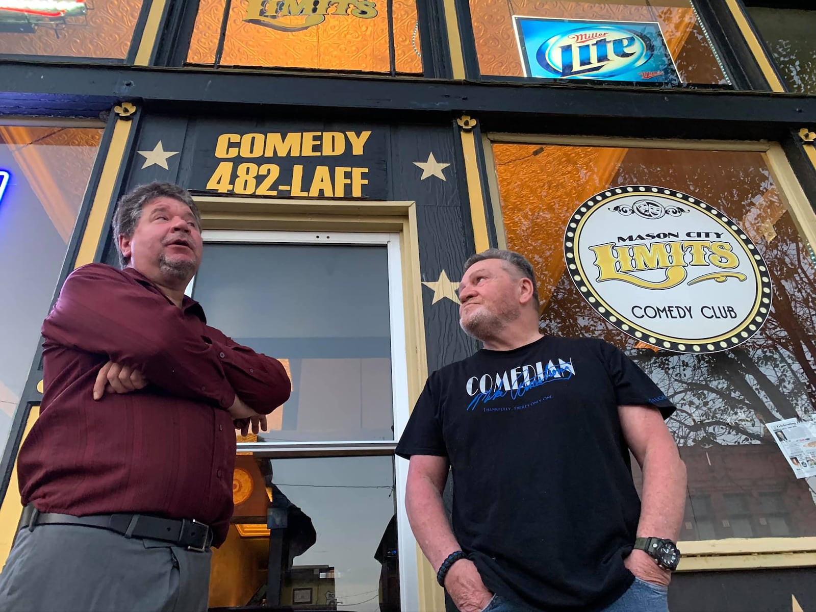 Spreyer (L) and Comedian Mike Armstrong is pictured front his club Mason City Limits in Illinois