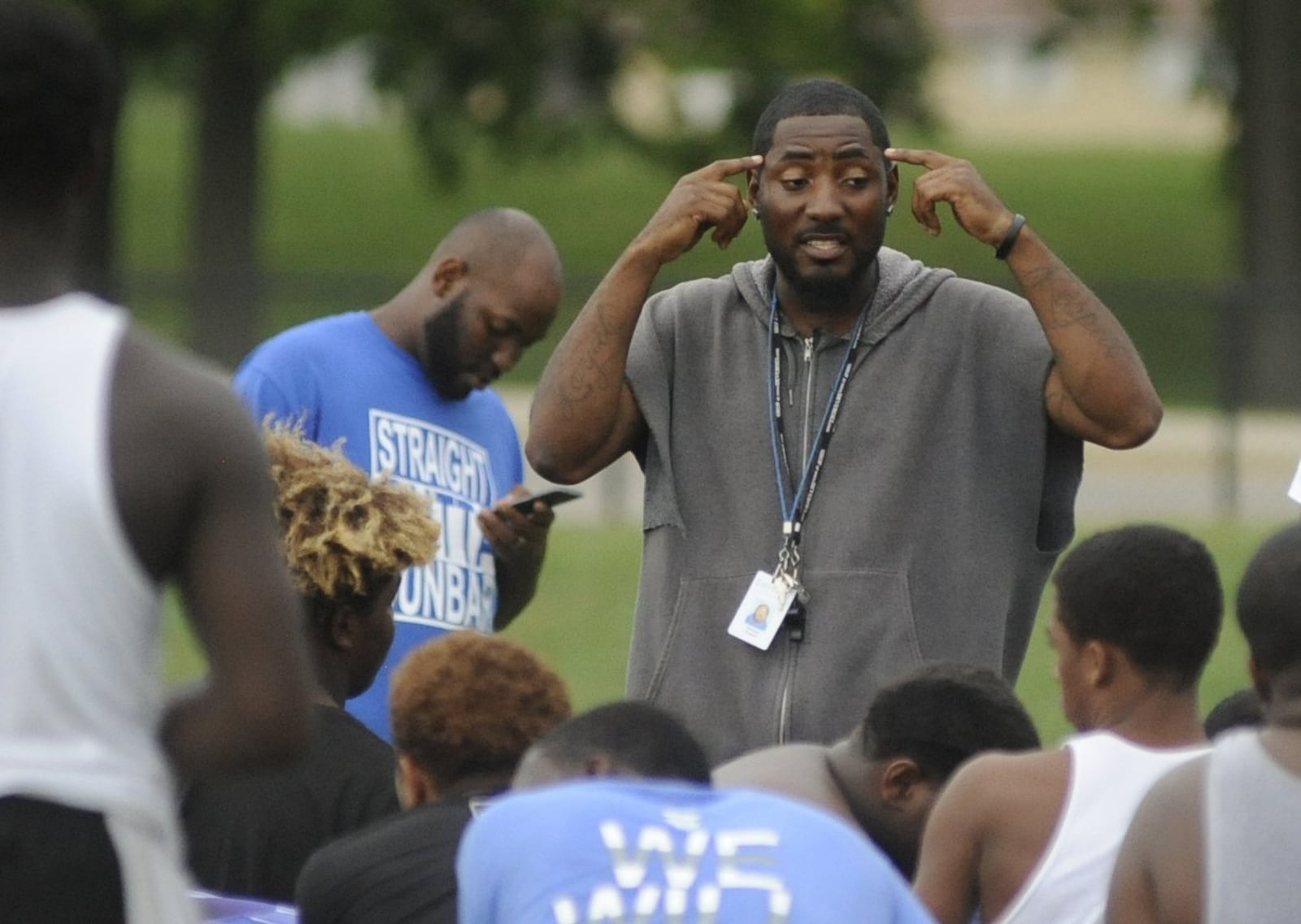 Dunbar head football coach Darran Powell addresses the Wolverines during practice on Thursday, Sept. 8, 2016. MARC PENDLETON / STAFF