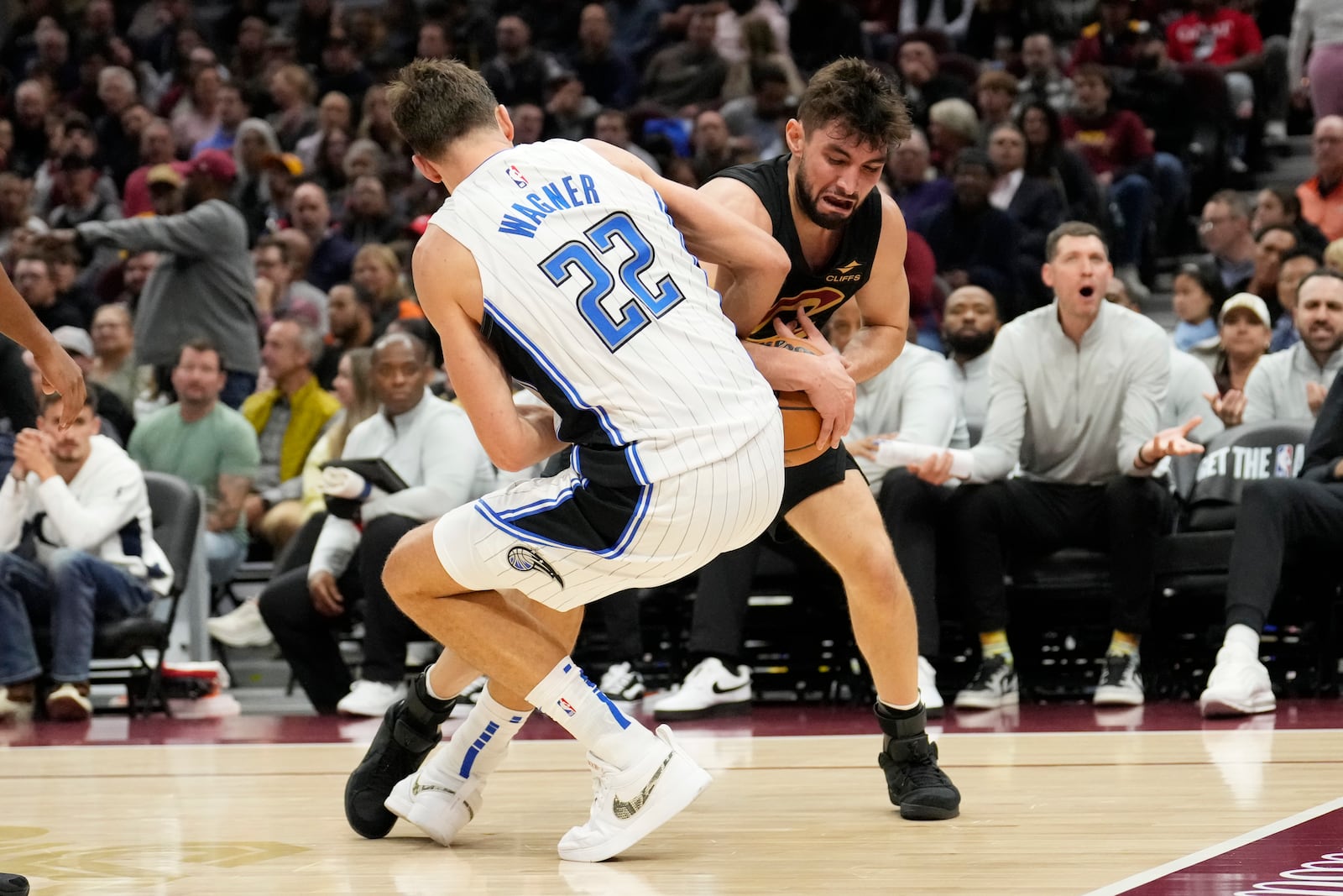 Cleveland Cavaliers guard Ty Jerome, right, takes the ball away from Orlando Magic forward Franz Wagner (22) in the first half of an NBA basketball game, Friday, Nov. 1, 2024, in Cleveland. (AP PhotoSue Ogrocki)