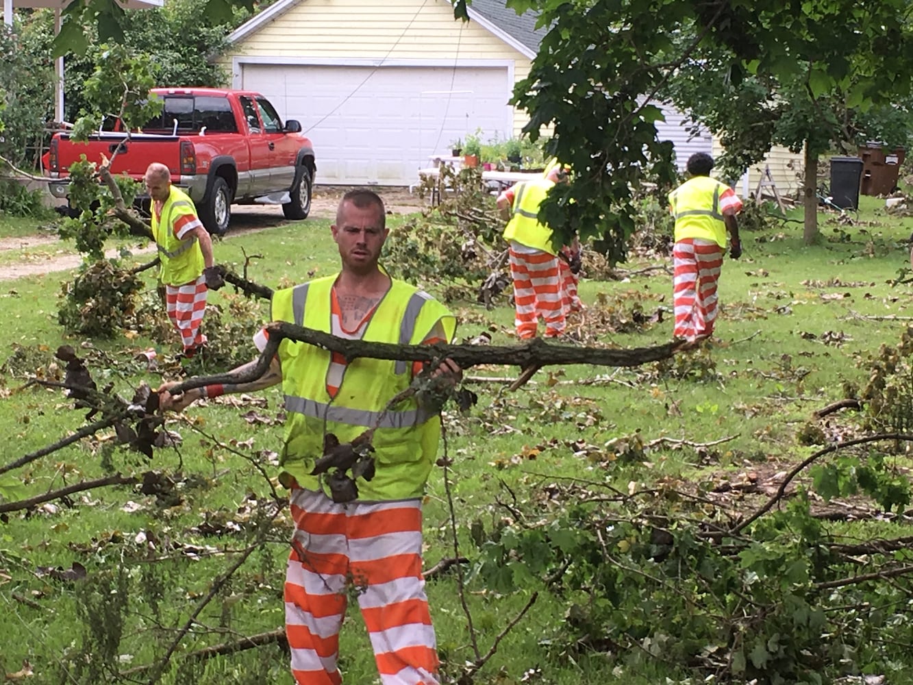 PHOTOS: Tornado-damaged communities dig out, clean up