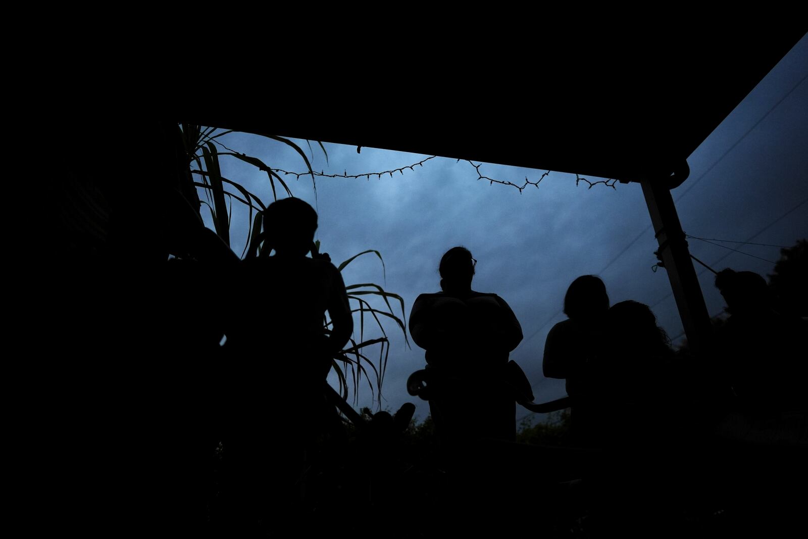 Women, who are in the U.S. illegally, and their children listen as Nora Sandigo explains their legal rights, as well as options to prepare their families in case a parent were to be detained or deported, Friday, Jan. 17, 2025, in Homestead, Fla. (AP Photo/Rebecca Blackwell)