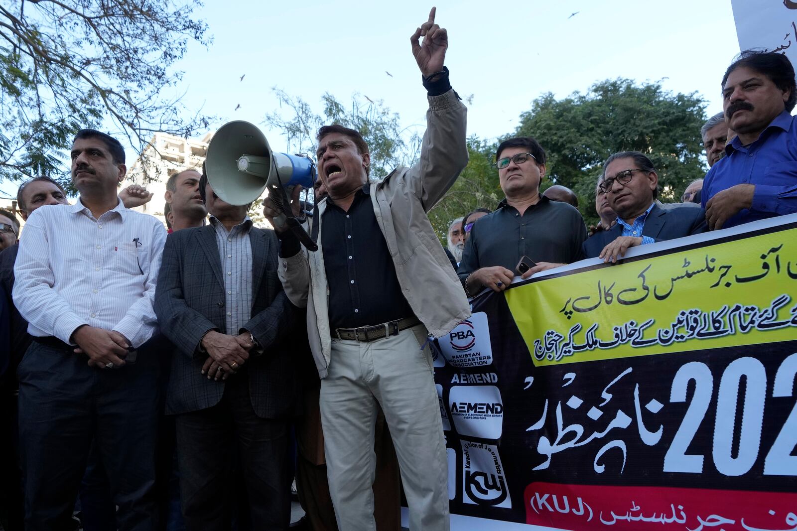 Journalists chant slogans during a demonstration in Karachi, Pakistan, Tuesday, Jan. 28, 2025, to condemn a controversial 'Prevention of Electronic Crimes Act' bill passed by parliament that critics argue is designed to suppress freedom of speech. (AP Photo/Fareed Khan)