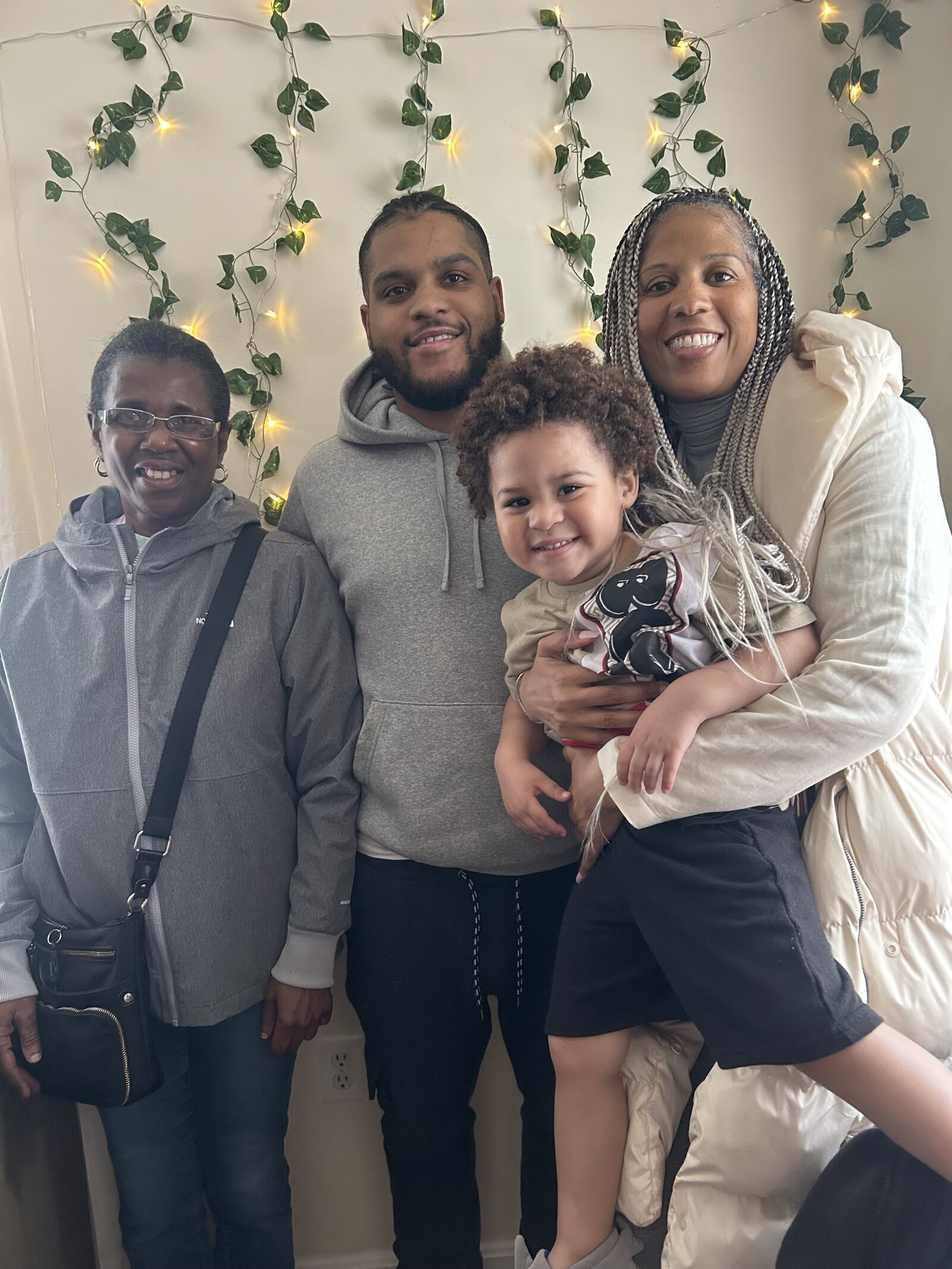 Rachel Naughton with her family. From left: sister Mary Naughton, son Tariq, and Tariq Jr. in her arms. CONTRIBUTED