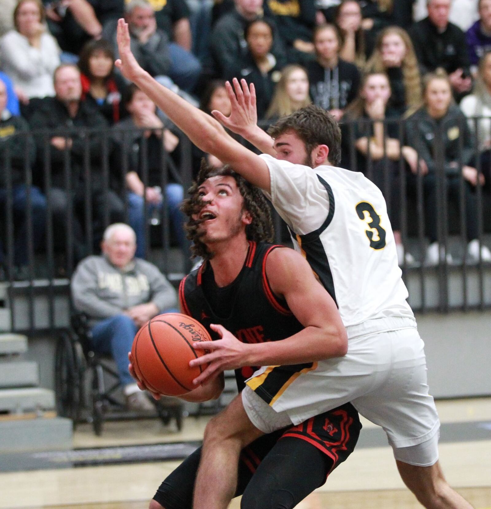 Malcolm Currey of Wayne (with ball) is covered by Andre Zimmerman of Centerville. Wayne defeated host Centerville 52-50 in a GWOC boys high school basketball game on Friday, Dec. 13, 2019. MARC PENDLETON / STAFF