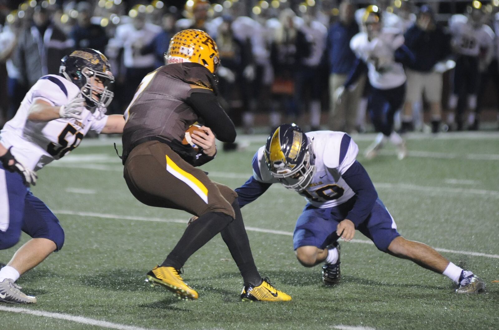 Alter QB Connor Bazelak makes a short gain. Alter defeated Norwalk 34-13 in a D-III high school football state semifinal at Wapakoneta’s Harmon Field on Friday, Nov. 23, 2018. MARC PENDLETON / STAFF