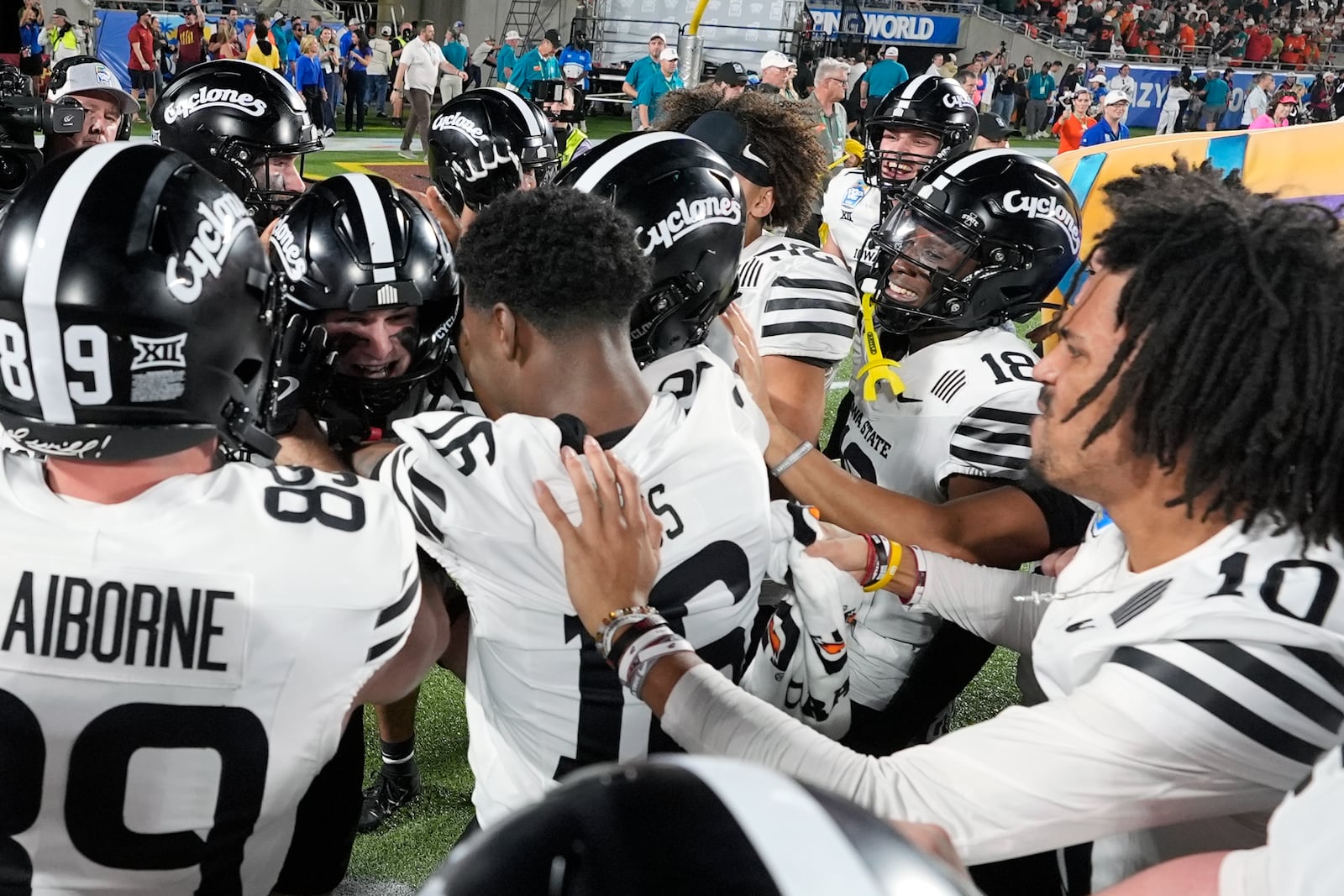 Iowa State players celebrate after defeating Miami in the Pop Tarts Bowl NCAA college football game, Saturday, Dec. 28, 2024, in Orlando, Fla. (AP Photo/John Raoux)