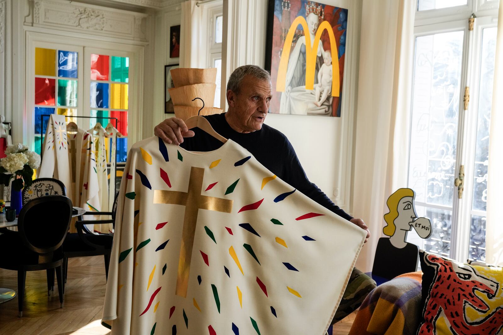 Designer Jean-Charles de Castelbajac displays a liturgical vestment for priests and to be worn at the reopening of Paris' Notre-Dame Cathedral in December, Wednesday, Nov. 20, 2024 in Paris. (AP Photo/Michel Euler)