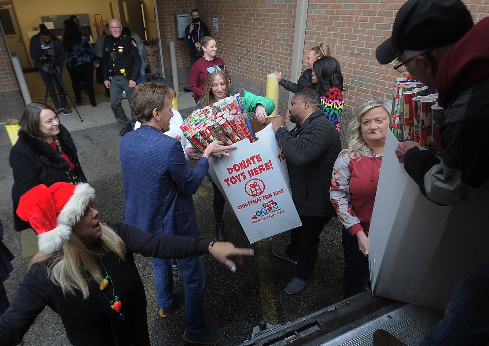 For Love of Children (FLOC) delivered Christmas wrapping paper and gifts to the Haines Children’s Center Wednesday, Dec. 14, 2022 for nearly 2,000 kids working with Montgomery County Children Services. MARSHALL GORBY\STAFF