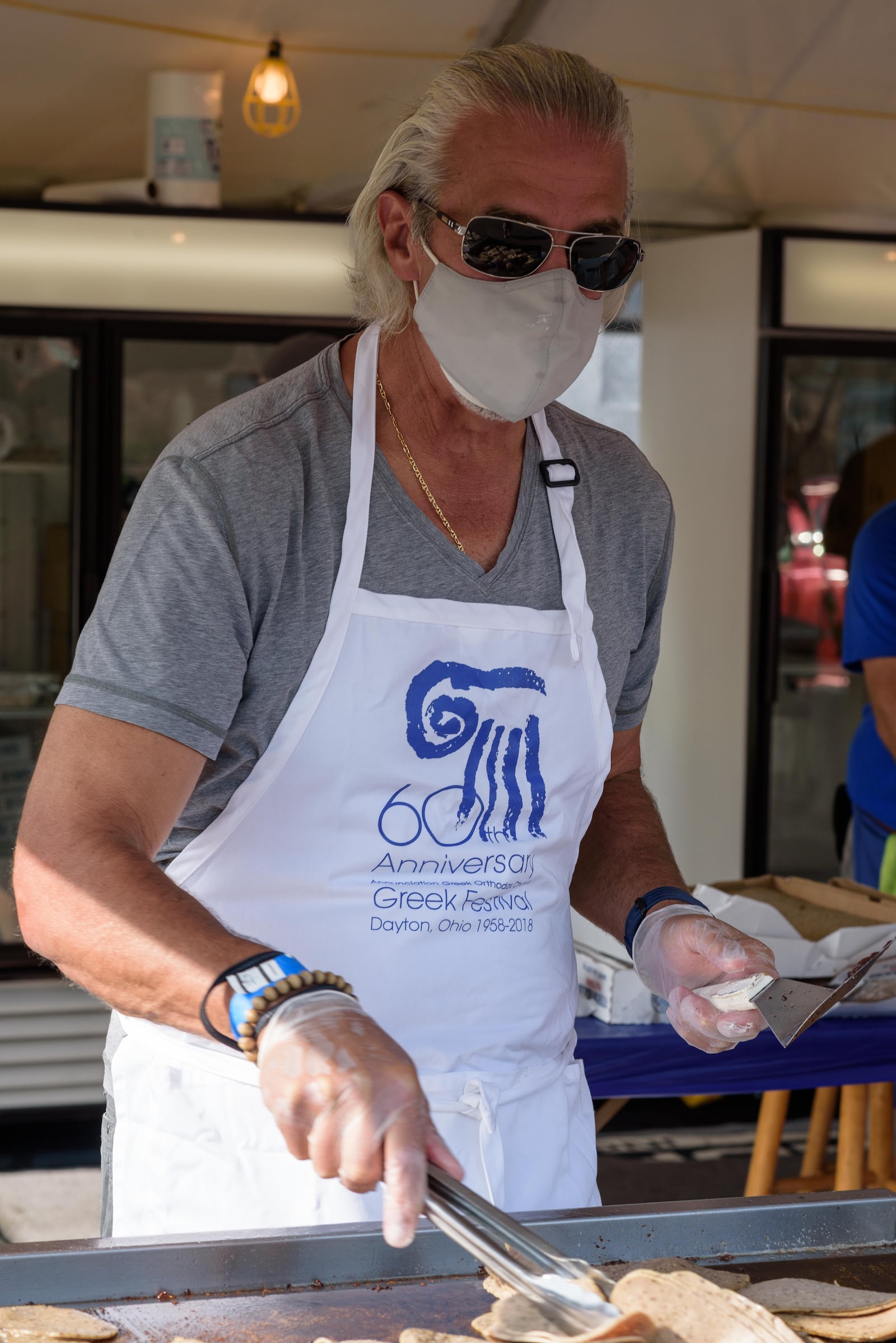 The 62nd Annual Dayton Greek Festival became the Greek Fest Express. Here's a look at the gyro making process at the outdoor grilling area. TOM GILLIAM/CONTRIBUTING PHOTOGRAPHER