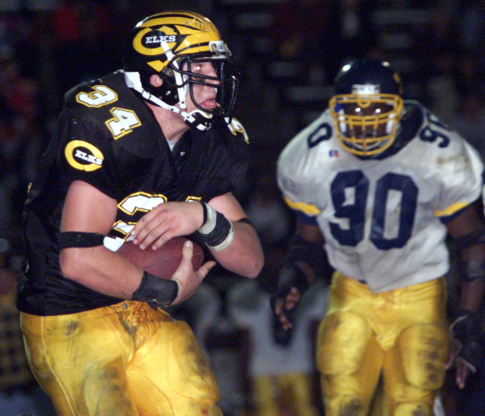 Centerville’s running back A.J. Hawk carries the ball in the game against Springfield South during the 2000 high school season.