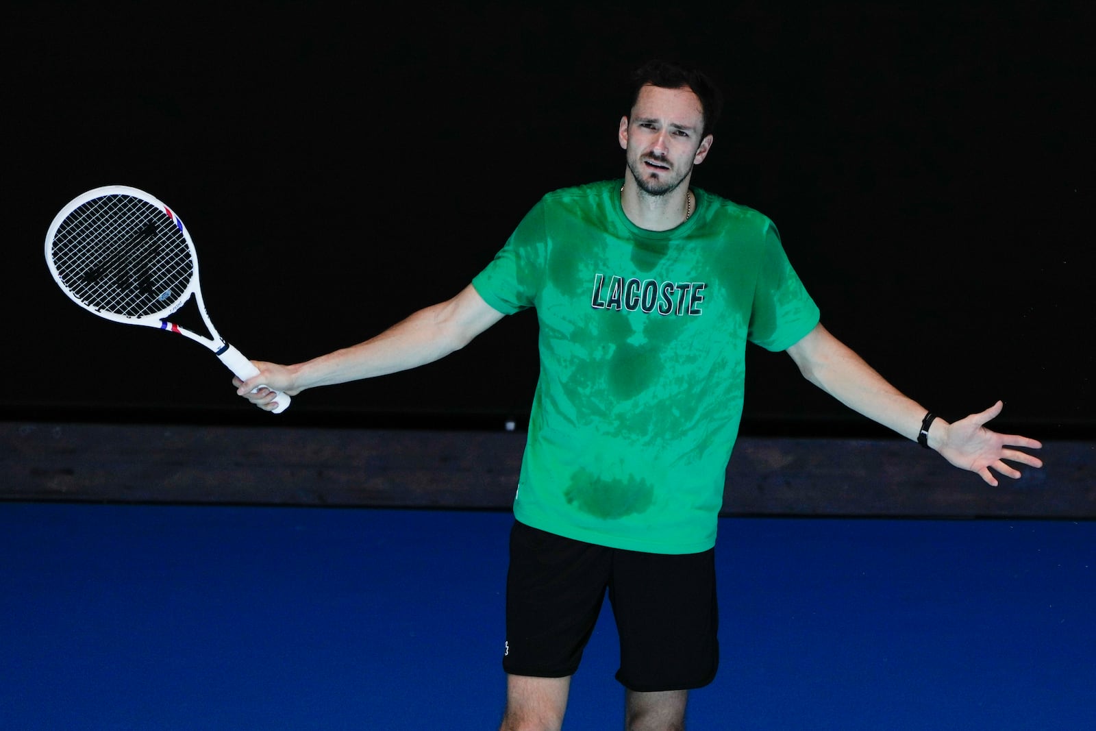 Russia's Daniil Medvedev reacts during a practice session ahead of the Australian Open tennis championship in Melbourne, Australia, Saturday, Jan. 11, 2025. (AP Photo/Ng Han Guan)