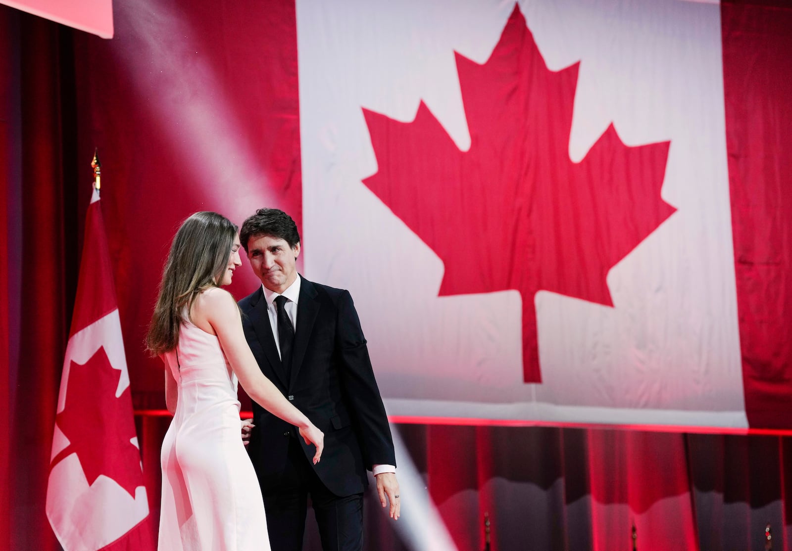 Canadian Prime Minister Justin Trudeau looks as his daughter Ella-Grace after she introduced him, at the Liberal Leadership Event in Ottawa, Ontario, Sunday, March 9, 2025. (Justin Tang/The Canadian Press via AP)