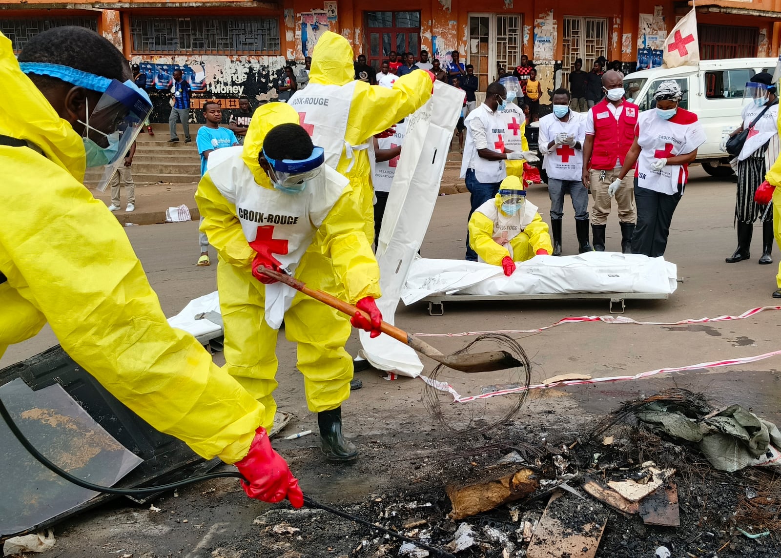 Red Cross workers clear the area in east Congo's second-largest city, Bukavu, one day after it was taken by M23 rebels, Monday, Feb. 17, 2025. (AP Photo/Janvier Barhahiga)