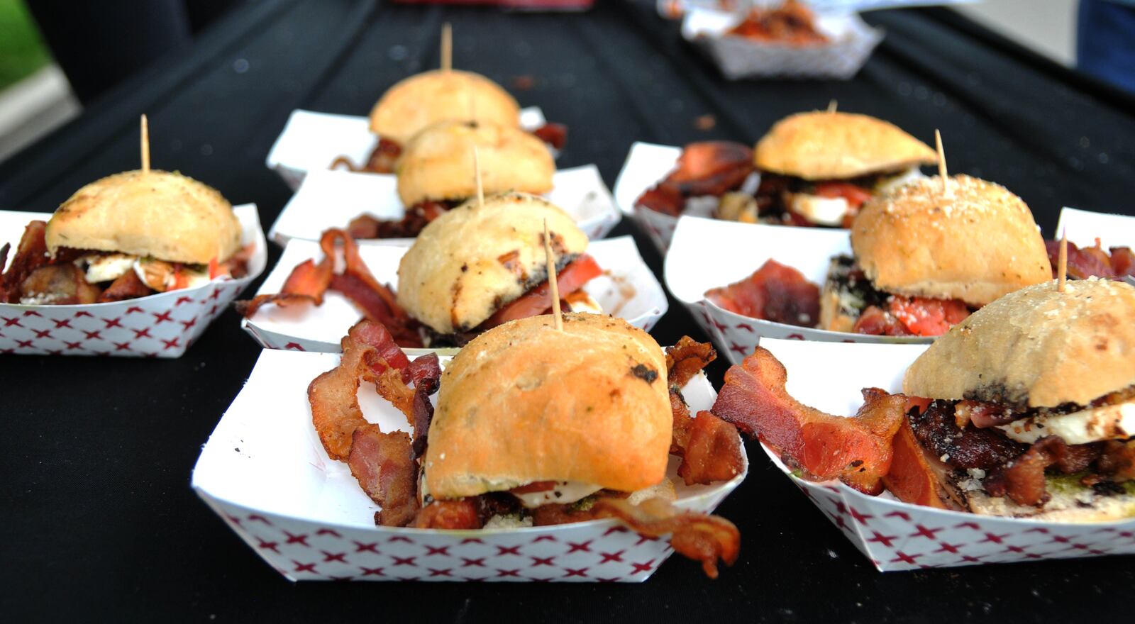 Local restaurants literally brought home the bacon during Bacon Fest 2022 at the Fraze Pavilion in Kettering on Saturday, August 13. A dozen food establishments prepared their best bacon dishes for the event which also featured live music and a variety of other tasty foods and beverages. David A. Moodie/Contributing Photographer