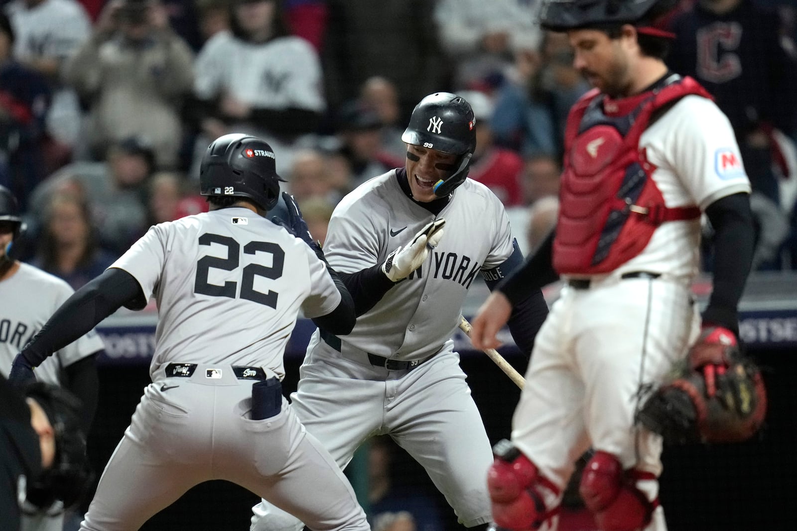 New York Yankees' Juan Soto (22) celebrates with Aaron Judge after hitting a two-run home run against the Cleveland Guardians during the first inning in Game 4 of the baseball AL Championship Series Friday, Oct. 18, 2024, in Cleveland. (AP Photo/Sue Ogrocki)