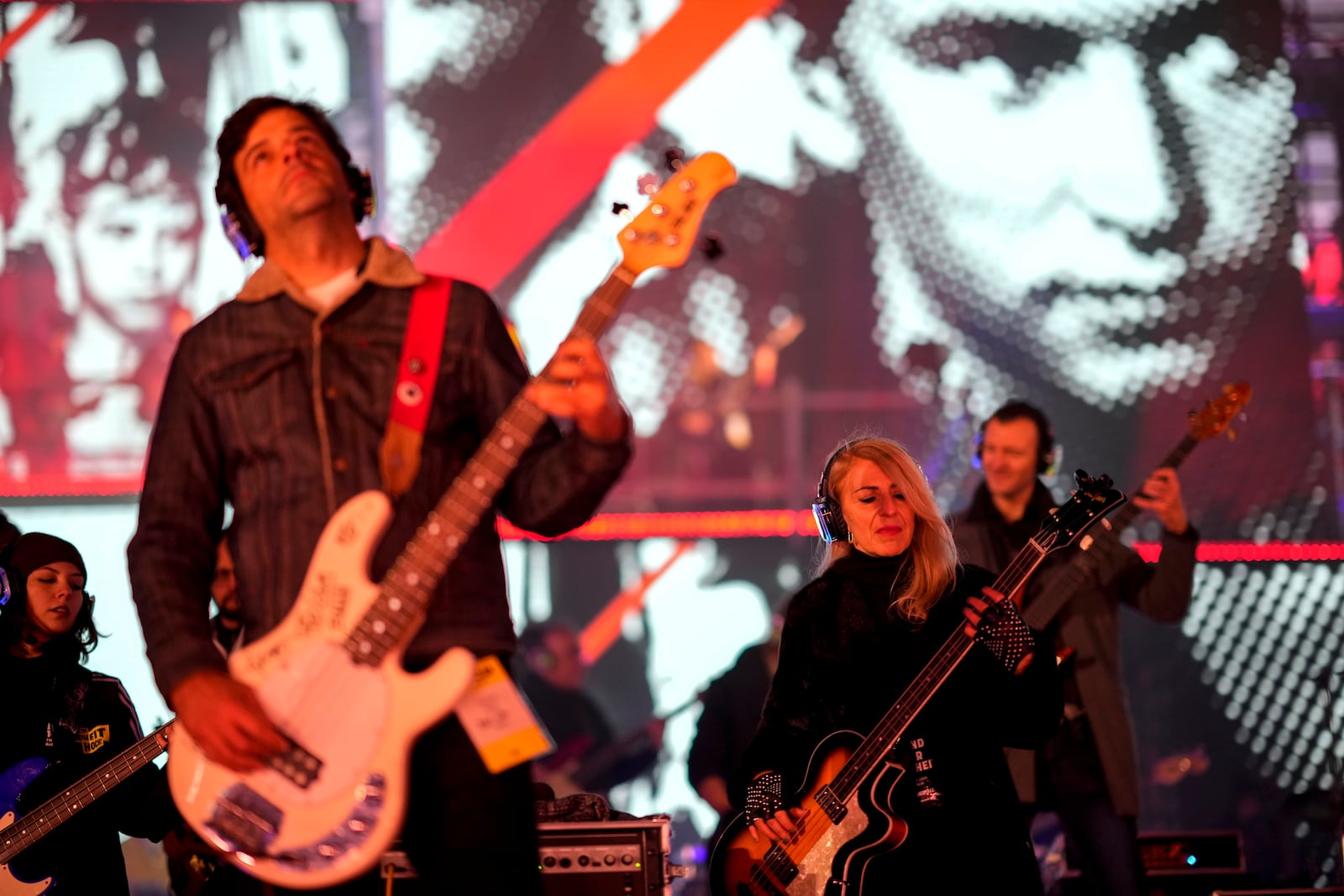 Musicians play on the stage during the concert for freedom for the 35th anniversary of the fall of the Berlin Wall, at the Brandenburg Gate in Berlin, Germany, Saturday, Nov. 9, 2024. (AP Photo/Ebrahim Noroozi)