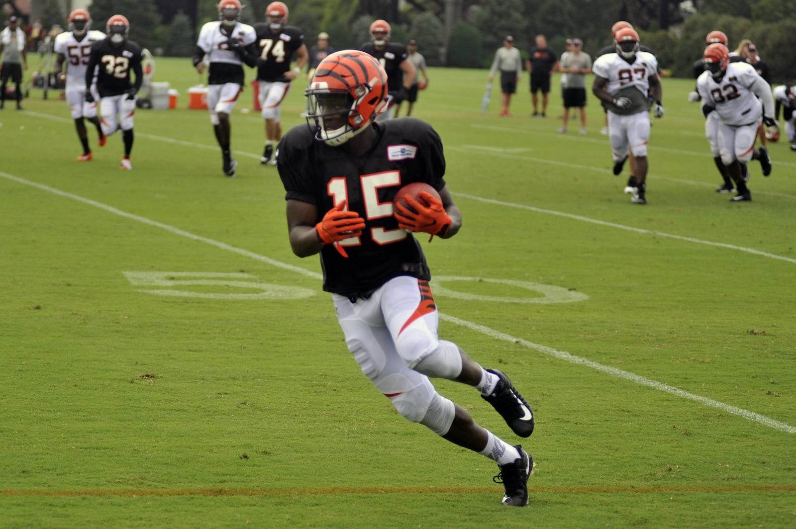 Cincinnati Bengals first-round pick John Ross turns up field after catching a pass in practice Monday at Paul Brown Stadium. JAY MORRISON/STAFF