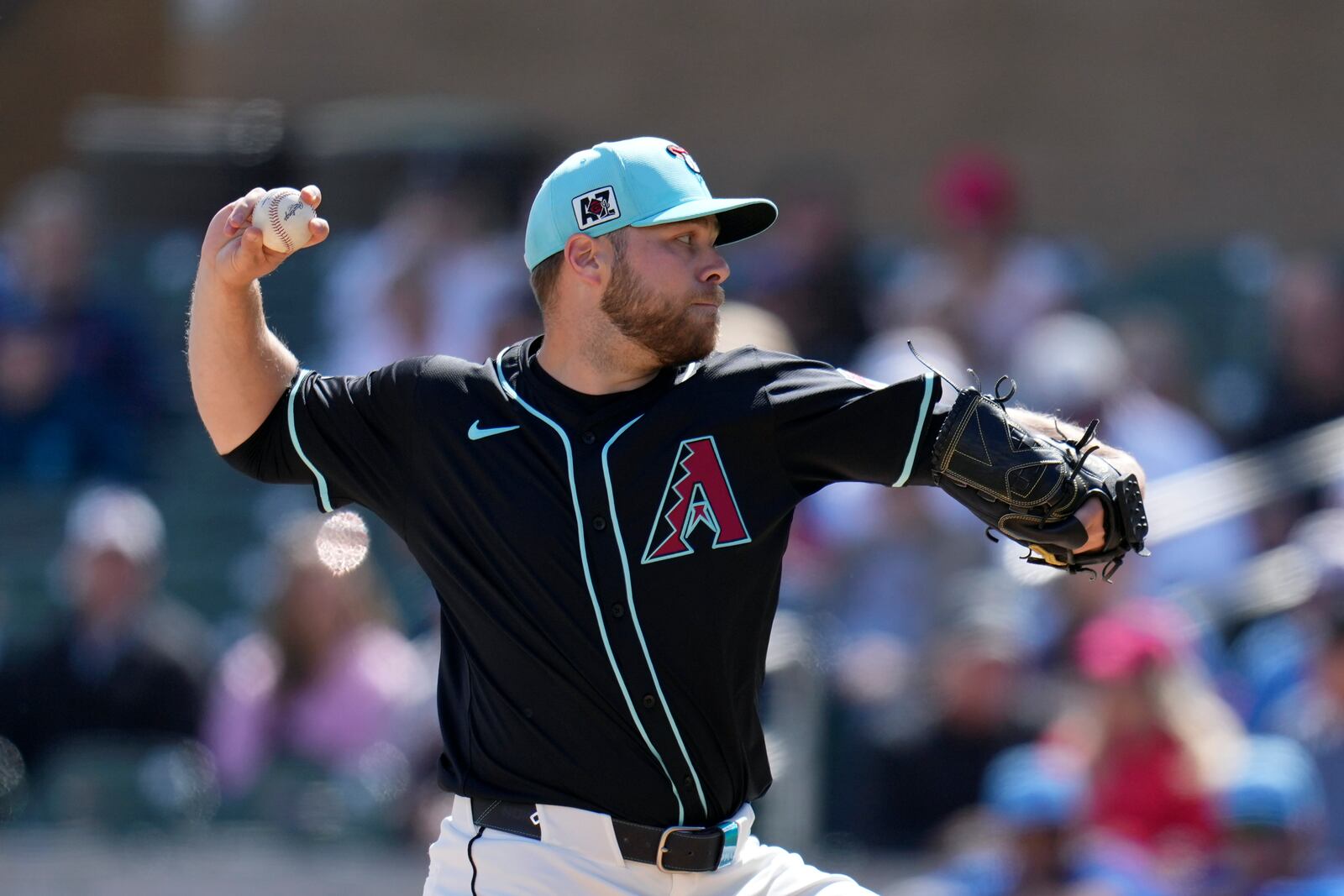 Arizona Diamondbacks starting pitcher Corbin Burnes throws against the Chicago Cubs during the first inning of a spring training baseball game Monday, March 3, 2025, in Scottsdale, Ariz. (AP Photo/Ross D. Franklin)