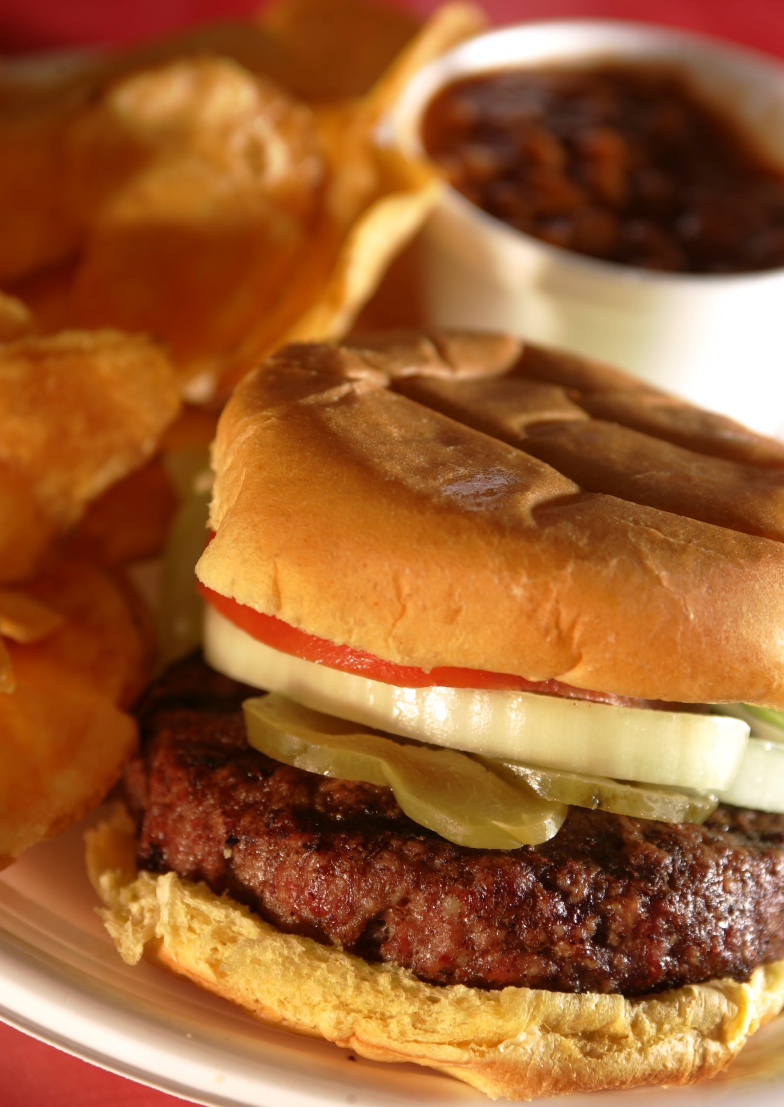 Smoked Hamburger at Smokin' BBQ on fifth Street with homemade chips and baked beans. Photo by Jim Witmer