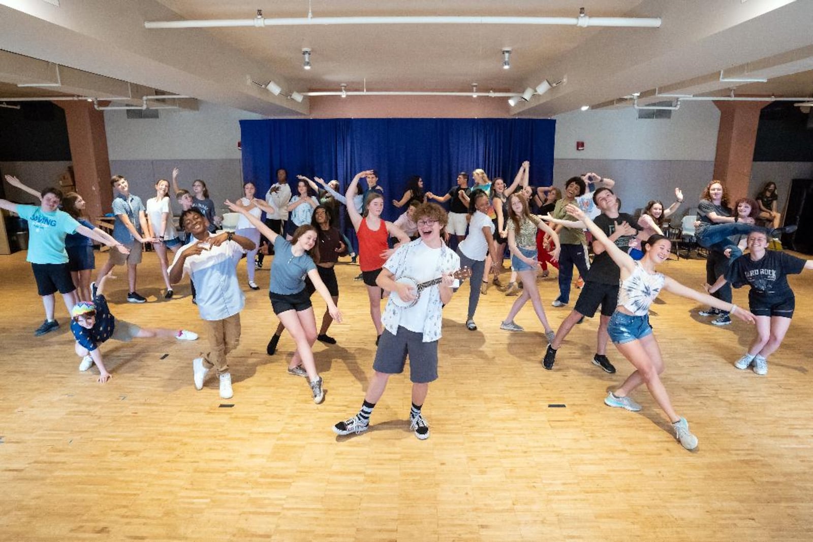 Griffin Greear (center as Uncle Fester Addams) and cast in rehearsal for the Muse Machine's production of "The Addams Family," slated June 17-19. PHOTO BY MATT SILVER