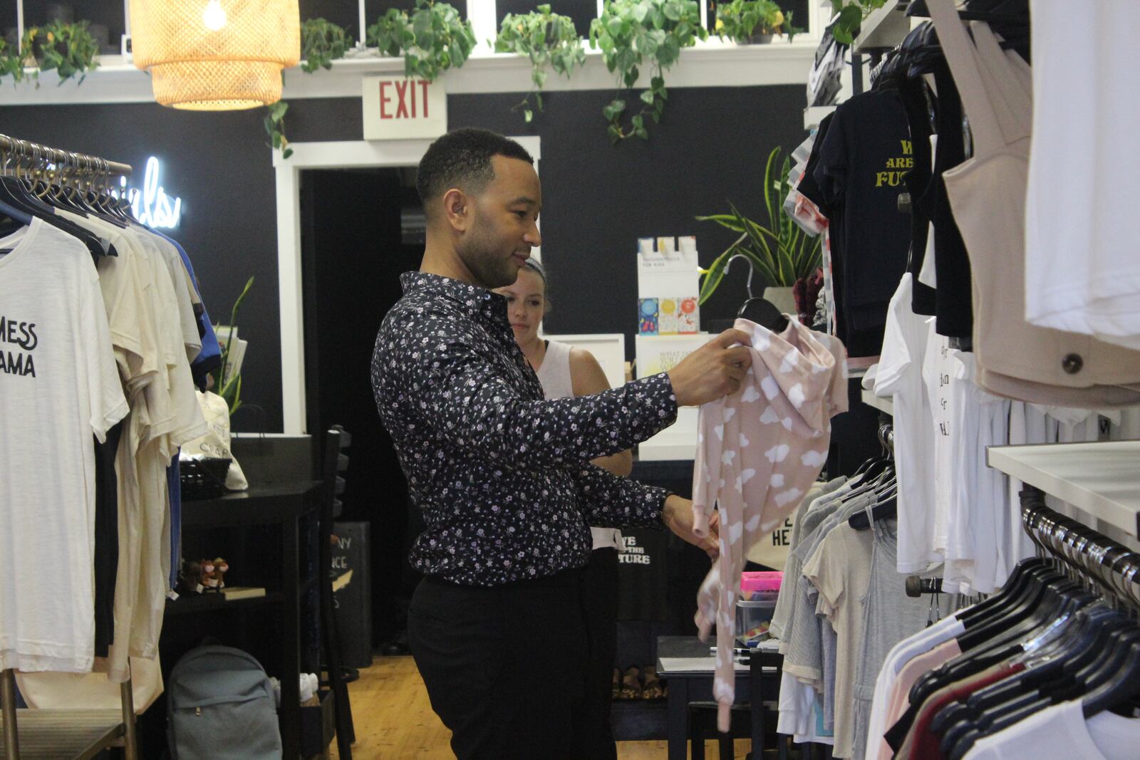 John Legend made a surprise visit to the Oregon District Sunday evening with Dayton Mayor Nan Whaley to show support in the aftermath of the mass shooting Sunday, Aug. 4. He stopped by a number of stores to shop including Heart Mercantile, Brim on Fifth, Puff Apothecary and Beck + Call. AMELIA ROBINSON / STAFF