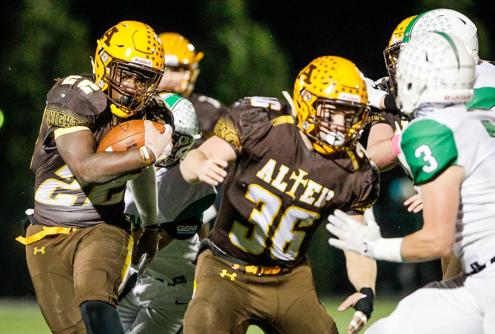 Alter’s Branden McDonald carries the ball during their Division III regional semifinal game against Badin Friday, Nov. 9 at Barnitz Stadium in Middletown. Alter won 13-0. NICK GRAHAM/STAFF