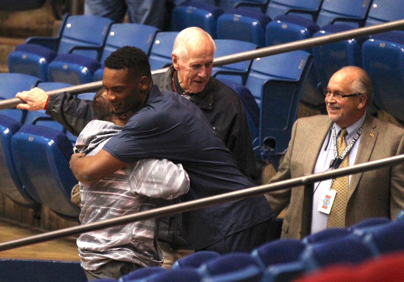 Dayton’s Dyshawn Pierre hugs Dr. Stephen Levitt before a game against Miami on Tuesday, Dec. 22, 2015, at UD Arena in Dayton. DAVID JABLONSKI | STAFF