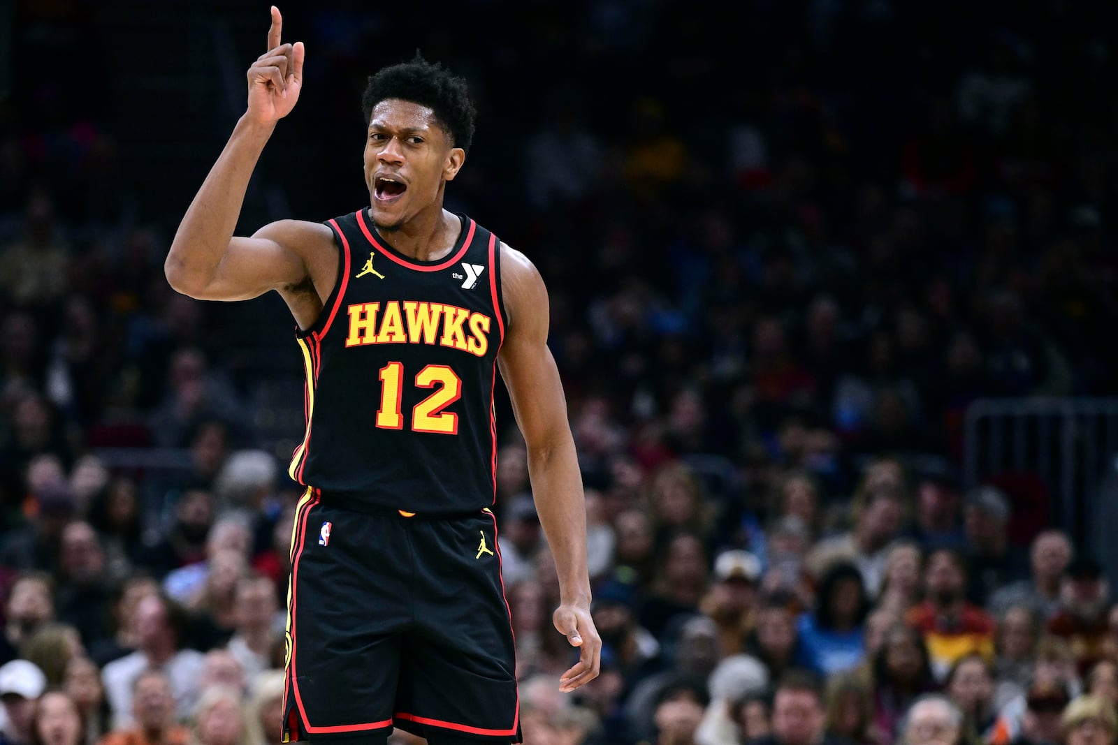 Atlanta Hawks forward De'Andre Hunter reacts after making a basket in the first half of an NBA basketball game against the Cleveland Cavaliers, Wednesday, Nov. 23, 2024, in Cleveland. (AP Photo/David Dermer)