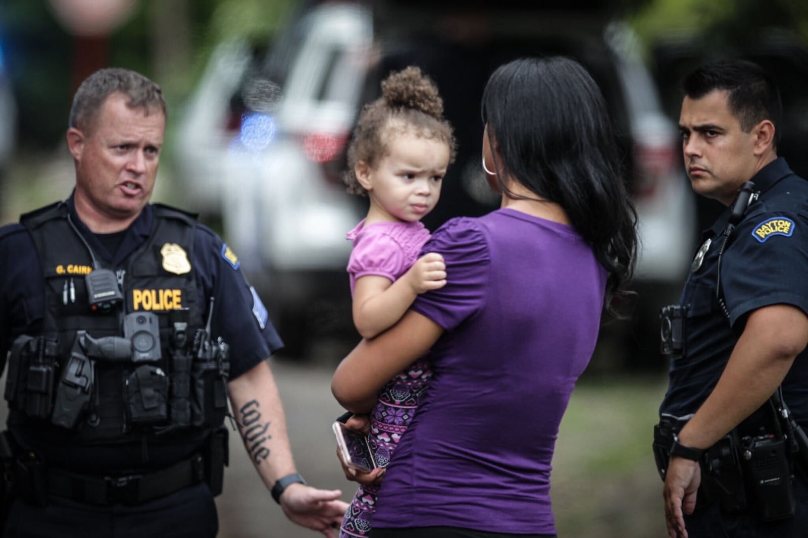 An Amazon delivery driver, Charles Rucker, found a 2-year-old girl who was inside a stolen car and then dropped off on the side of the road in Harrison Twp. Rucker stayed with the girl until police arrived and she then was reunited with her mother, Razshae Wood. STAFF PHOTO / JIM NOELKER