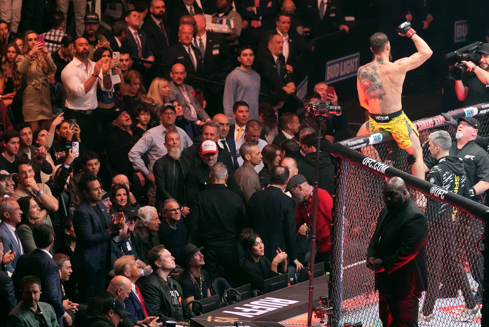 Dana White, Vivek Ramaswamy, President-elect Donald Trump, Elon Musk and Kid Rock watch as Brazil's Mauricio Ruffy celebrates his win over Peru's James Llontop at UFC 309 at Madison Square Garden, Saturday, Nov. 16, 2024, in New York. (AP Photo/Evan Vucci)