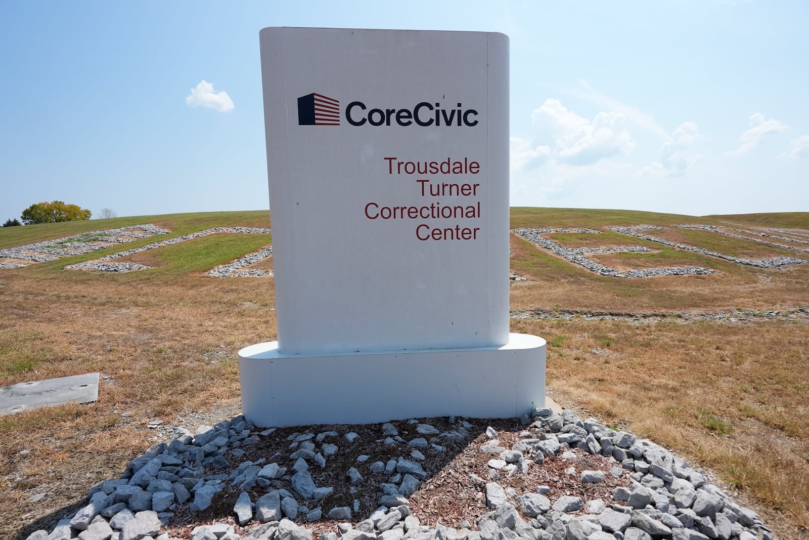 A sign outside Trousdale Turner Correctional Center operated by CoreCivic is seen Thursday, Aug. 29, 2024, in Hartsville, Tenn. (AP Photo/George Walker IV)