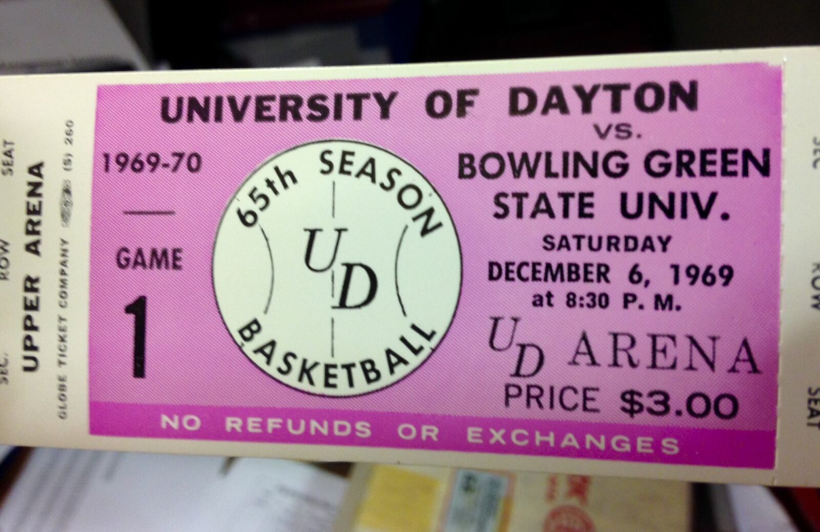 This is a ticket from the first Flyers basketball game at UD Arena in 1969. Gary McCans, former director of premium seating, has boxes of old tickets from arena games and concerts. BRIAN KOLLARS / STAFF